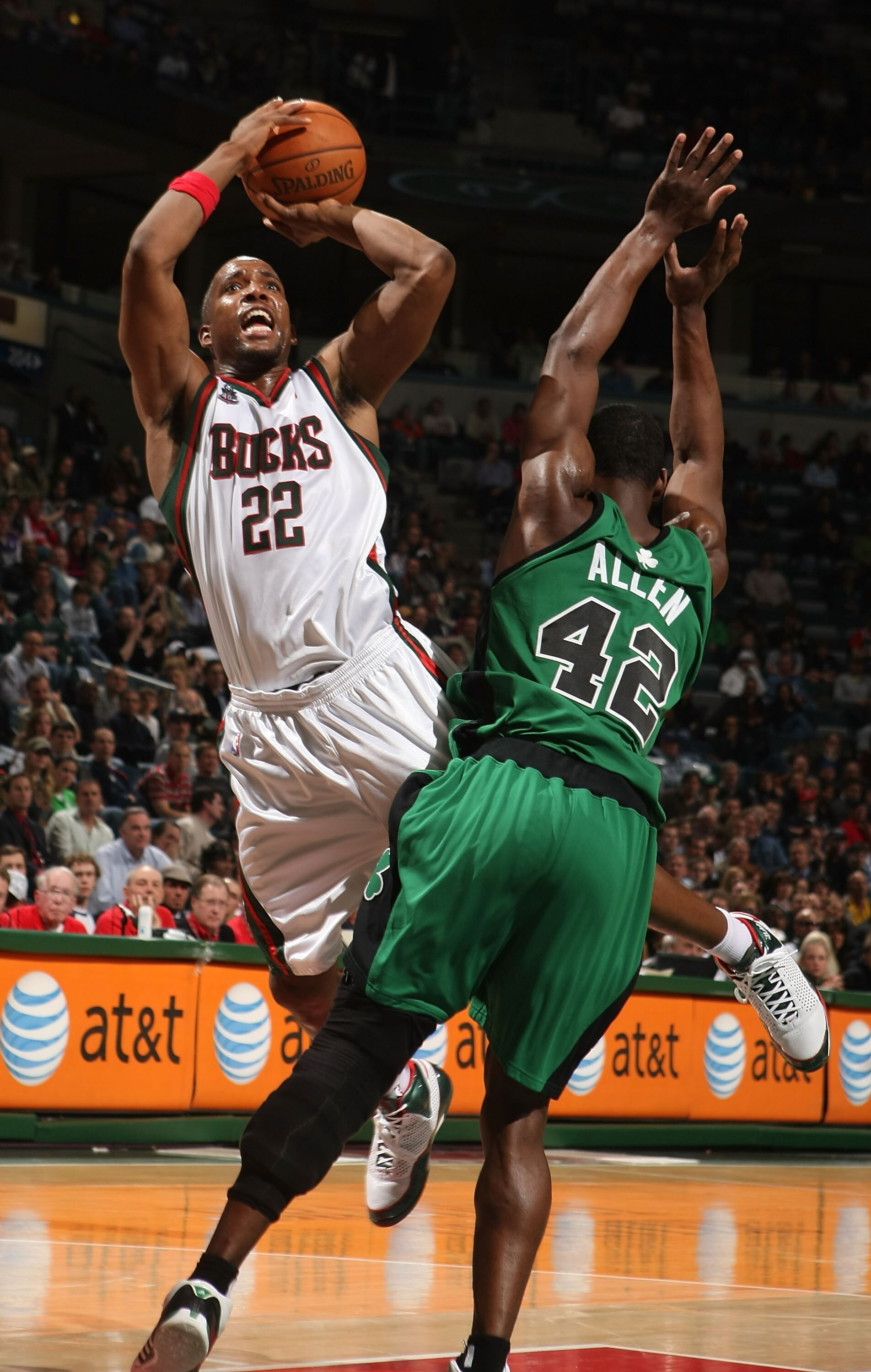 MILWAUKEE - APRIL 08: Michael Redd #22 of the Milwaukee Bucks is fouled while shooting by Tony Allen #45 of the Boston Celtics on April 8, 2008 at the Bradley Center in Milwaukee, Wisconsin. The Celtics defeated the Bucks 107-104 in overtime. NOTE TO USER