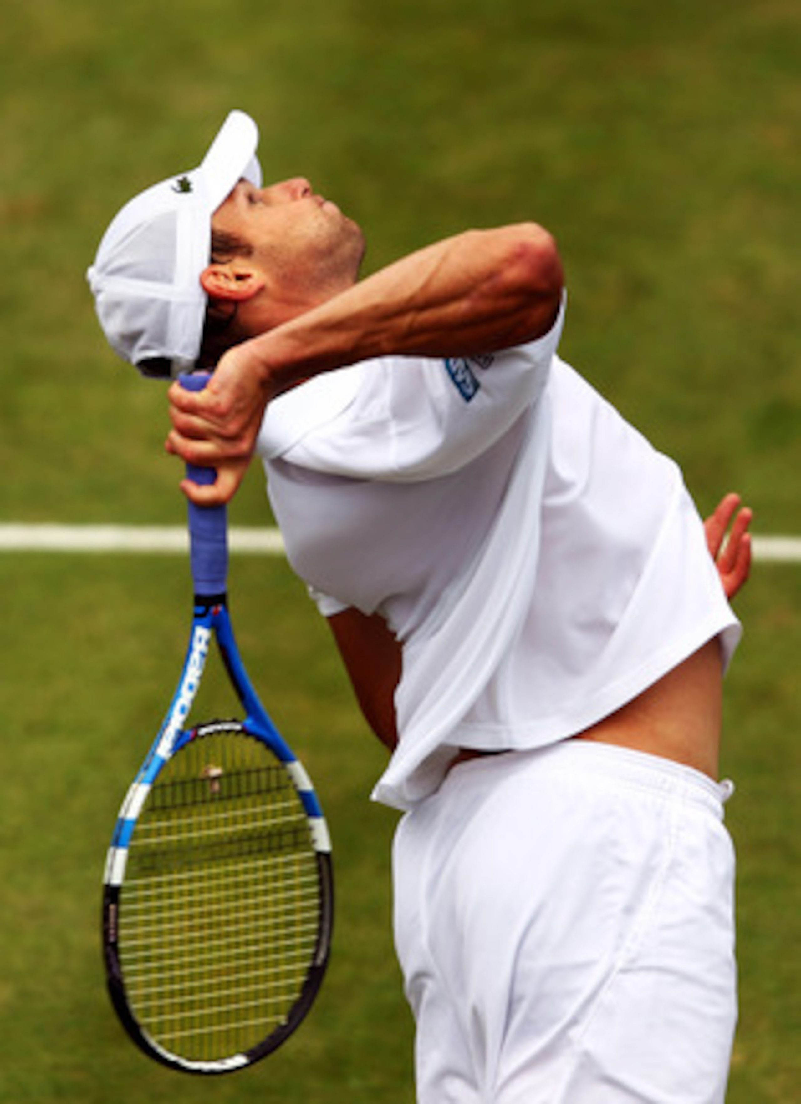 LONDON, ENGLAND - JUNE 09:  Andy Roddick of the United States serves during his Men's Singles third round match against Kevin Anderson of South Africa on day four of the AEGON Championships at Queens Club on June 9, 2011 in London, England.  (Photo by Cli