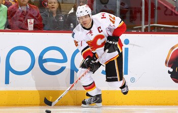 GLENDALE, AZ - MARCH 10:  Jarome Iginla #12 of the Calgary Flames skates with the puck during the NHL game against the Phoenix Coyotes at Jobing.com Arena on March 10, 2011 in Glendale, Arizona.  The Coyotes defeated the Flames 3-0.  (Photo by Christian P