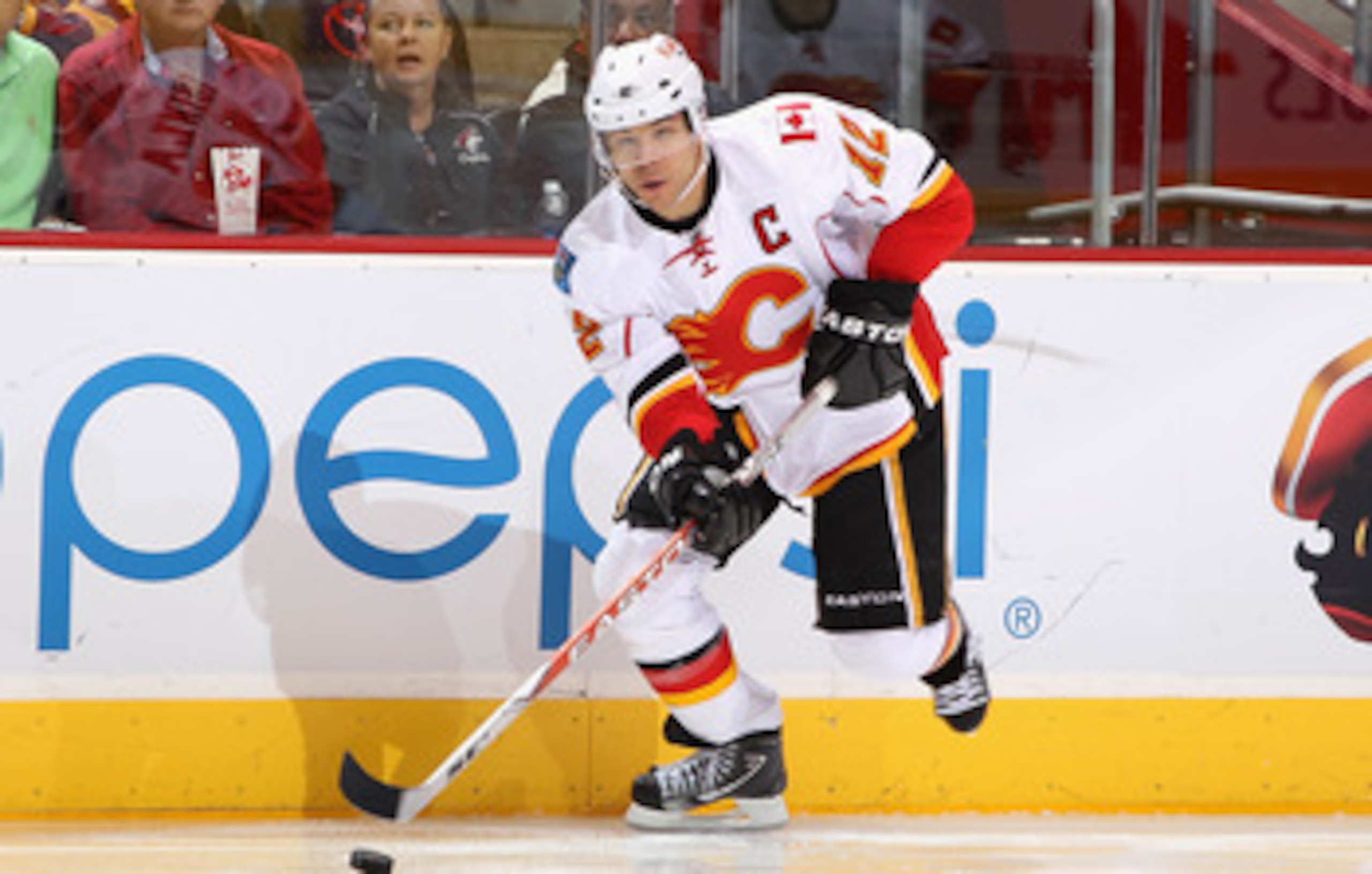 GLENDALE, AZ - MARCH 10:  Jarome Iginla #12 of the Calgary Flames skates with the puck during the NHL game against the Phoenix Coyotes at Jobing.com Arena on March 10, 2011 in Glendale, Arizona.  The Coyotes defeated the Flames 3-0.  (Photo by Christian P