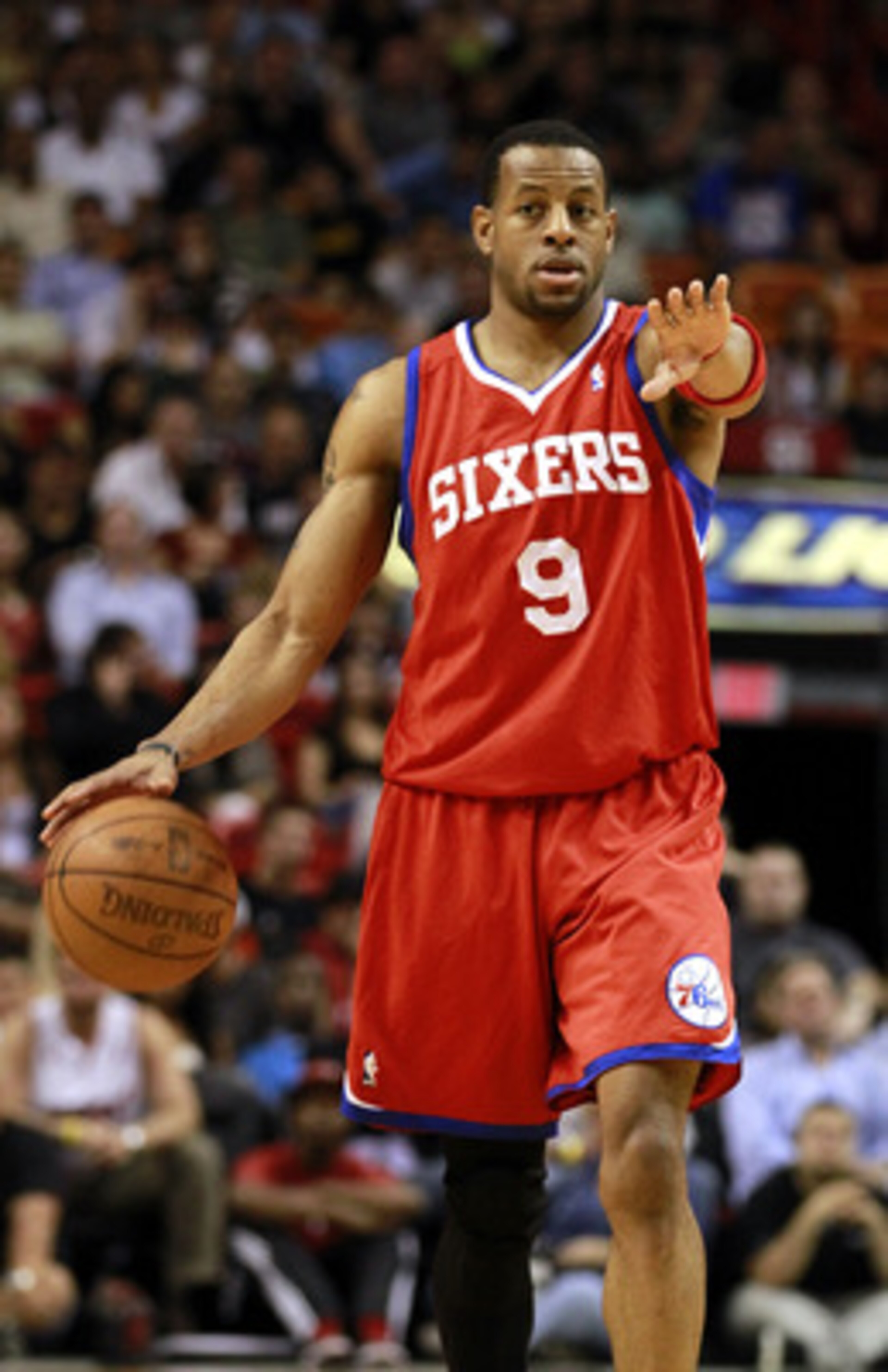 MIAMI, FL - MARCH 25:  Guard Andr Iguodala #9 of the Philadelphia Sixers brings up the ball against the Miami Heat at American Airlines Arena on March 25, 2011 in Miami, Florida. The Heat defeated the Sixers 111-99. NOTE TO USER: User expressly acknowledg