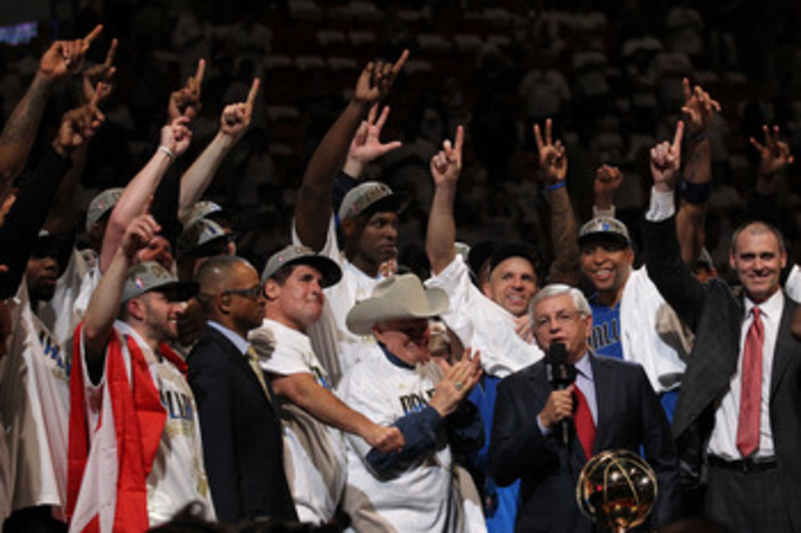 MIAMI, FL - JUNE 12:  NBA Commissioner David Stern presents the Larry O'Brien trophy to the Dallas Mavericks founder Don J. Carter next to team owner Mark Cuban after the Mavericks won 105-95 against the Miami Heat in Game Six of the 2011 NBA Finals at Am