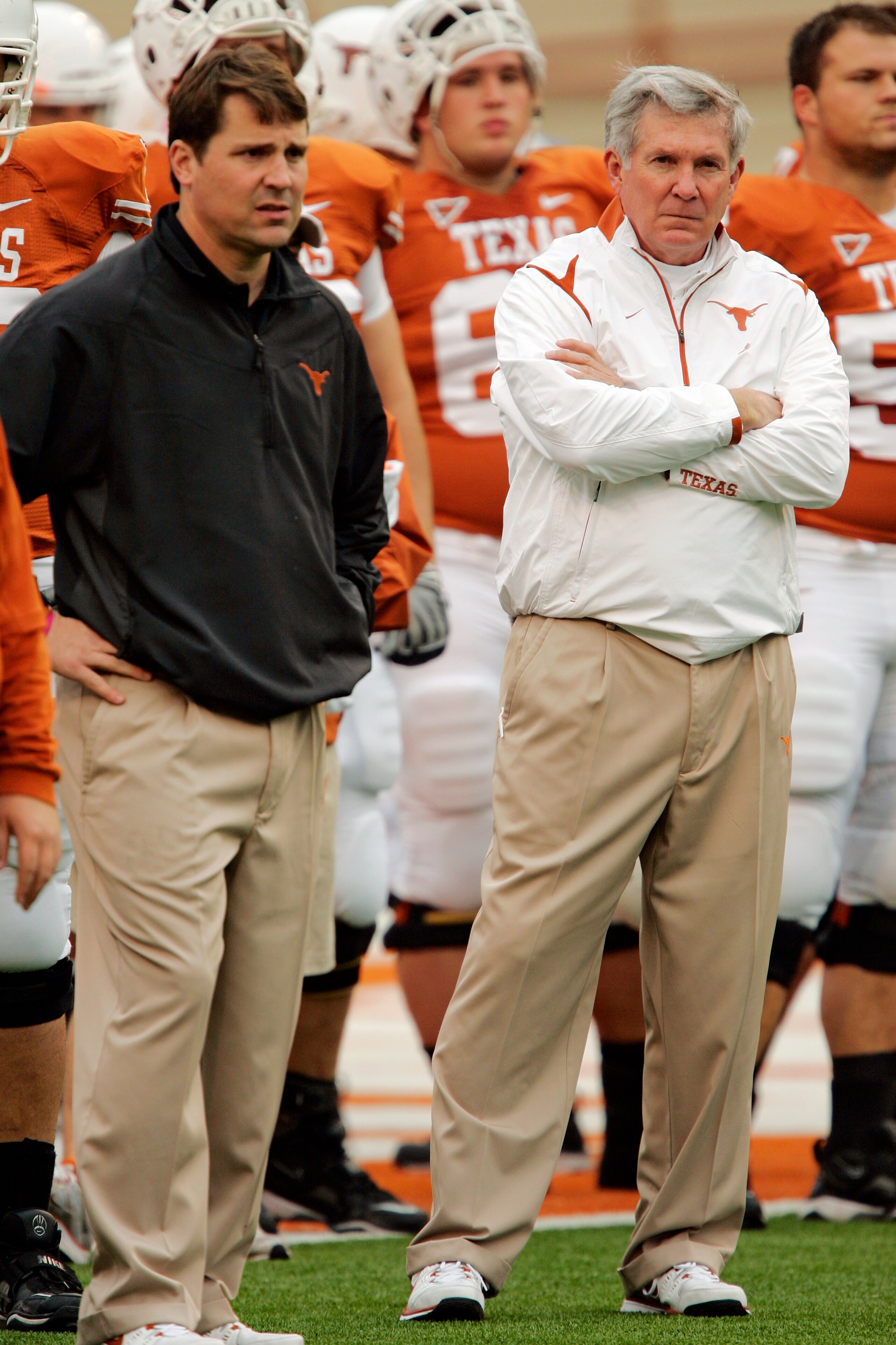 AUSTIN, TX - OCTOBER 10: Defensive coordinator Will Muschamp and head coach Mack Brown of the Texas Longhorns lead their team in pregame drills before playing the Colorado Buffaloes on October 10, 2009 at the Darrell K Royal-Texas Memorial Stadium in Aust