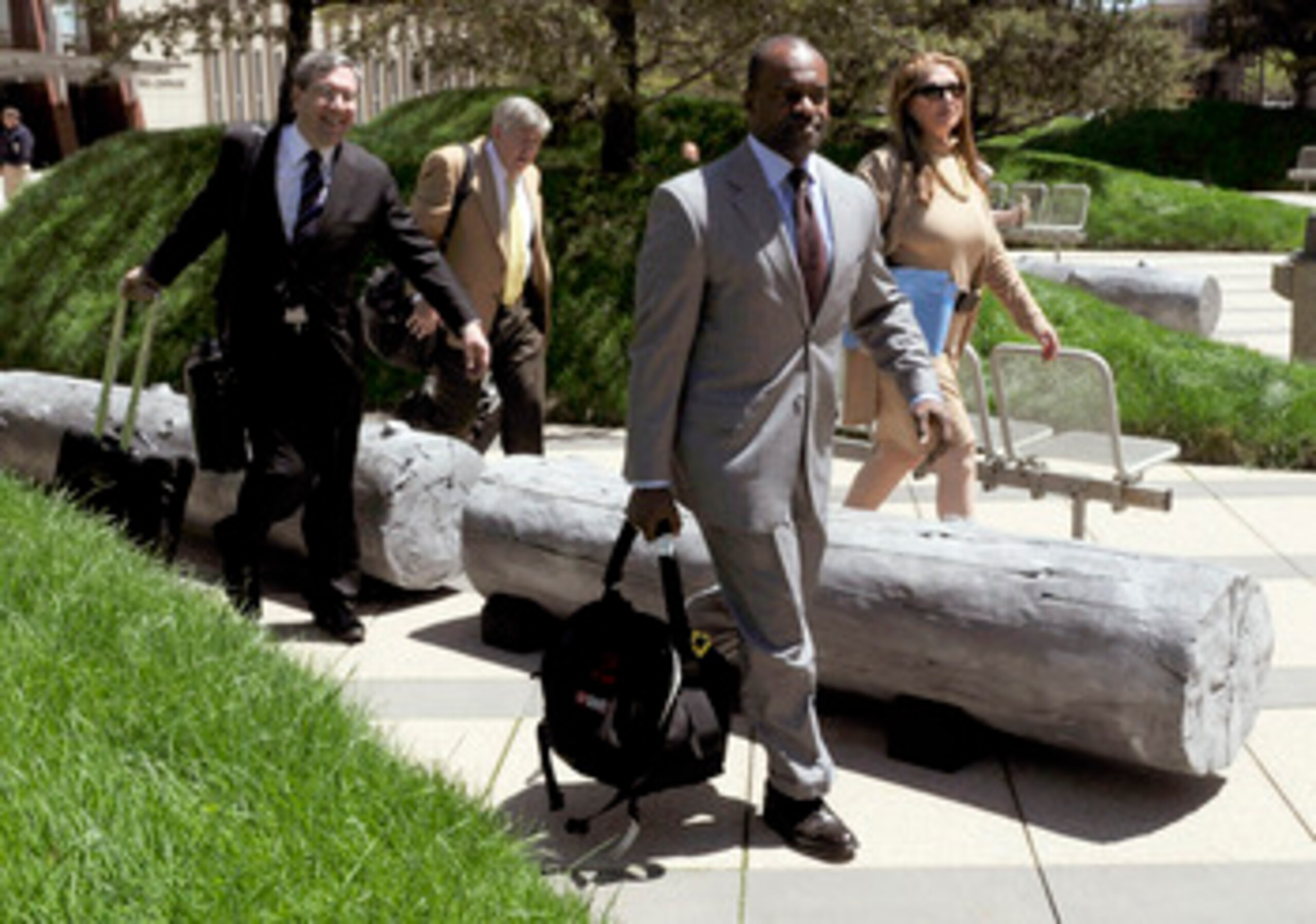 MINNEAPOLIS, MN - MAY 17: NFL players' lawyers Jeffrey Kessler, James Quinn and Barbara P. Berens walk with former NFL Players Association executive director DeMaurice Smith after leaving court ordered mediation at the U.S. Courthouse on May 17, 2011 in M