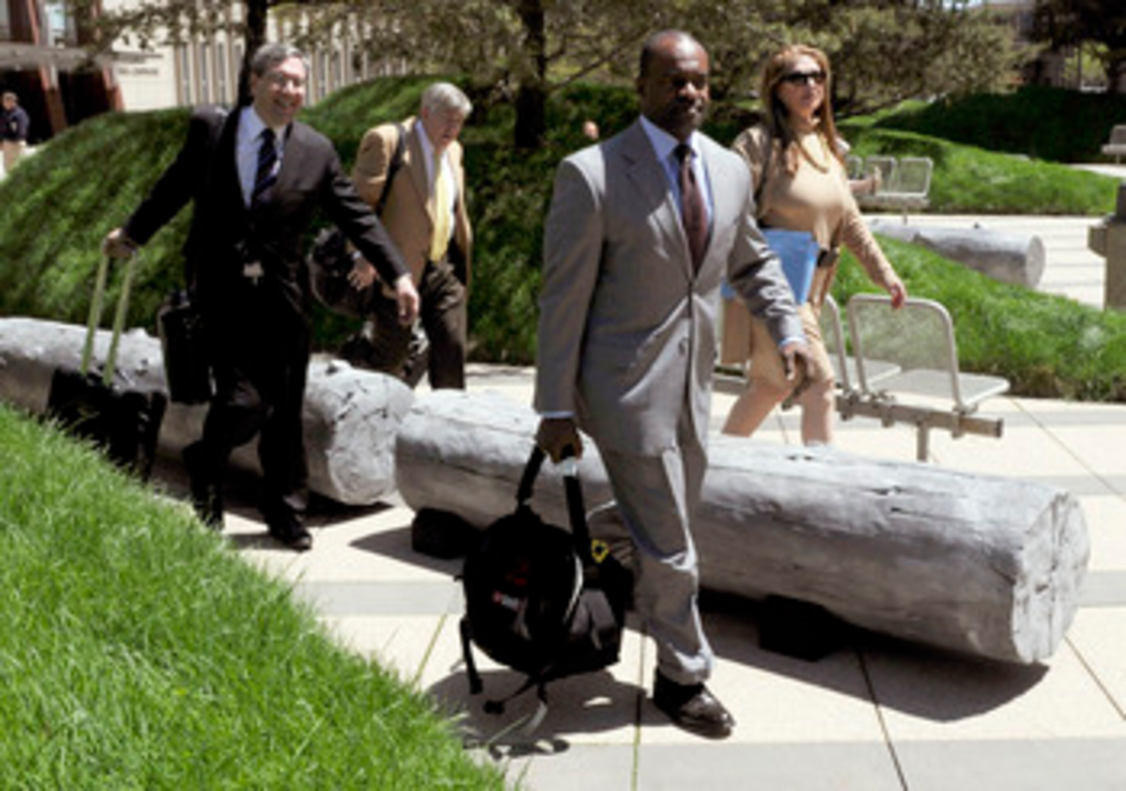 MINNEAPOLIS, MN - MAY 17: NFL players' lawyers Jeffrey Kessler, James Quinn and Barbara P. Berens walk with former NFL Players Association executive director DeMaurice Smith after leaving court ordered mediation at the U.S. Courthouse on May 17, 2011 in M