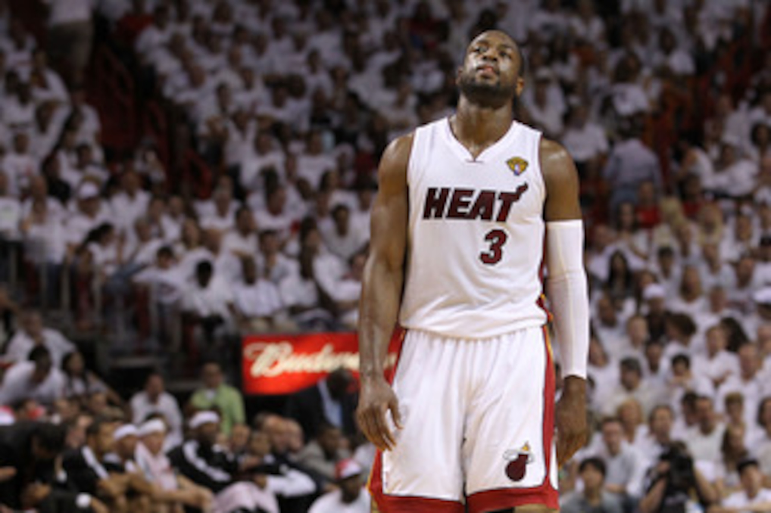 MIAMI, FL - JUNE 12:  Dwyane Wade #3 of the Miami Heat reacts while taking on the Dallas Mavericks in Game Six of the 2011 NBA Finals at American Airlines Arena on June 12, 2011 in Miami, Florida. NOTE TO USER: User expressly acknowledges and agrees that,