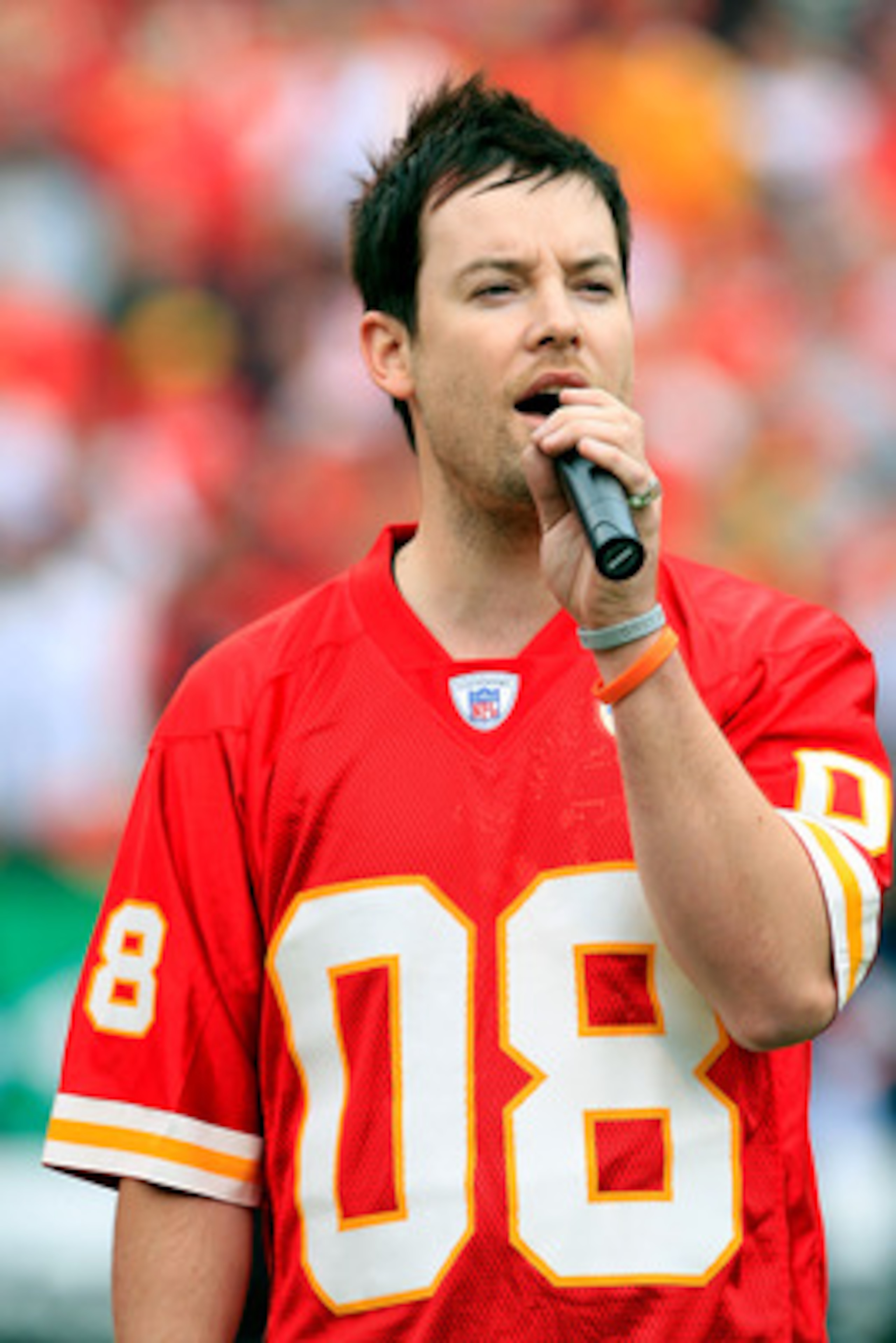 KANSAS CITY, MO - SEPTEMBER 14:  American Idol winner David Cook sings the National Anthem prior to the start of the game between the Oakland Raiders and the Kansas City Chiefs on September 14, 2008 at Arrowhead Stadium in Kansas City, Missouri.  (Photo b