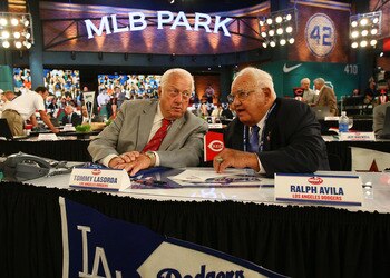 SECAUCUS, NJ - JUNE 07:  Team representative Tommy Lasorda and Ralph Avila both of the Los Angeles Dodgers look on during the MLB First Year Player Draft on June 7, 2010 held in Studio 42 at the MLB Network in Secaucus, New Jersey.  (Photo by Mike Stobe/G