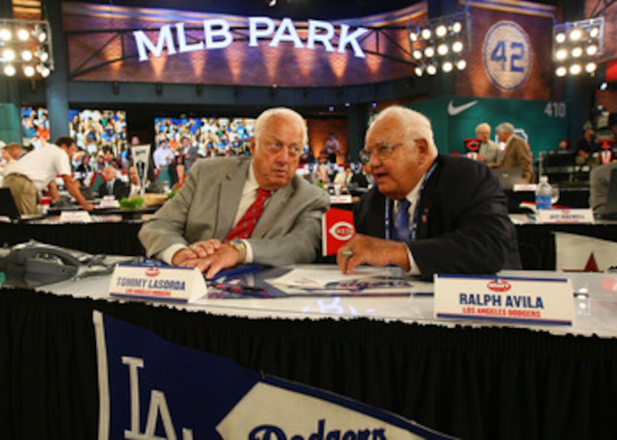 SECAUCUS, NJ - JUNE 07:  Team representative Tommy Lasorda and Ralph Avila both of the Los Angeles Dodgers look on during the MLB First Year Player Draft on June 7, 2010 held in Studio 42 at the MLB Network in Secaucus, New Jersey.  (Photo by Mike Stobe/G