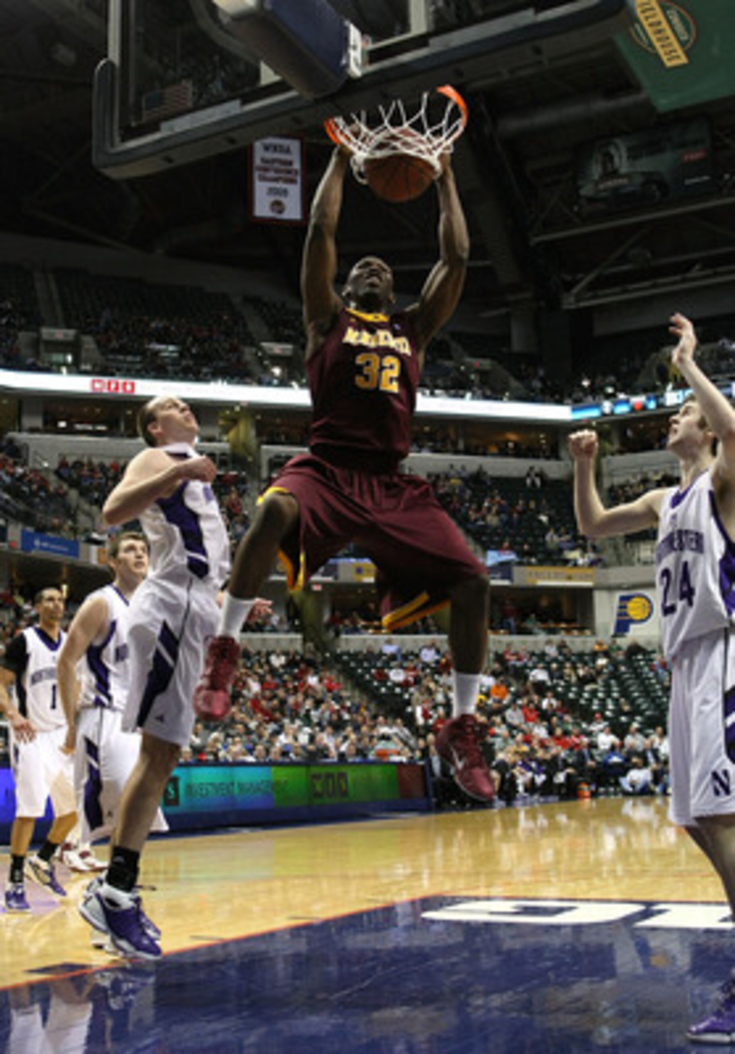INDIANAPOLIS, IN - MARCH 10:  Trevor Mbakwe #32 of the Minnesota Golden Gophers dunks against the Northwestern Wildcats during the first round of the 2011 Big Ten Men's Basketball Tournament at Conseco Fieldhouse on March 10, 2011 in Indianapolis, Indiana