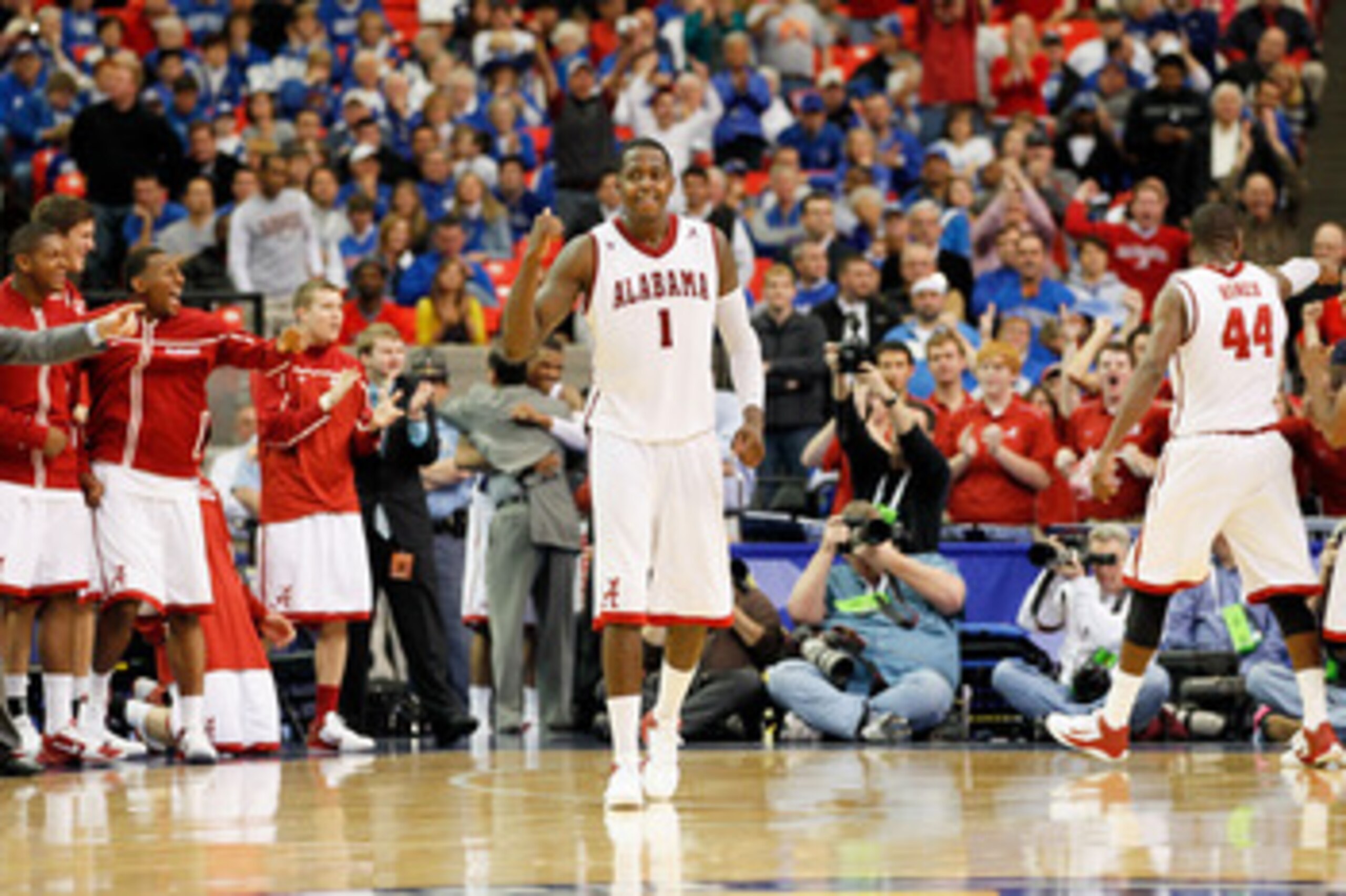 ATLANTA, GA - MARCH 11:  JaMychal Green #1 of the Alabama Crimson Tide celebrates after defeating the Georgia Bulldogs 65 to 59 in the quarterfinals of the SEC Men's Basketball Tournament at Georgia Dome on March 11, 2011 in Atlanta, Georgia.  (Photo by K