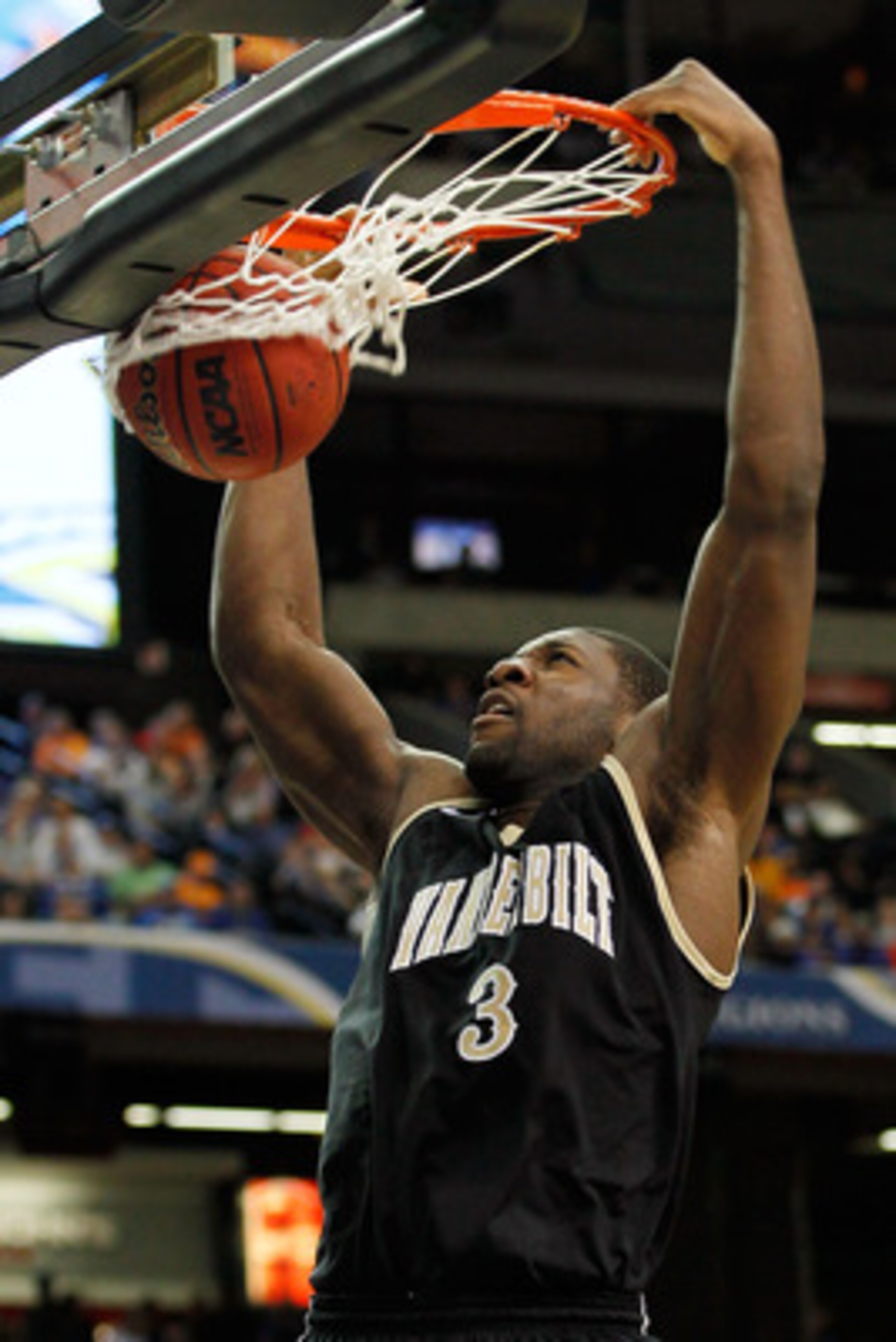ATLANTA, GA - MARCH 12:  Festus Ezeli #3 of the Vanderbilt Commodores dunks on the Florida Gators during the semifinals of the SEC Men's Basketball Tournament at Georgia Dome on March 12, 2011 in Atlanta, Georgia.  (Photo by Kevin C. Cox/Getty Images)