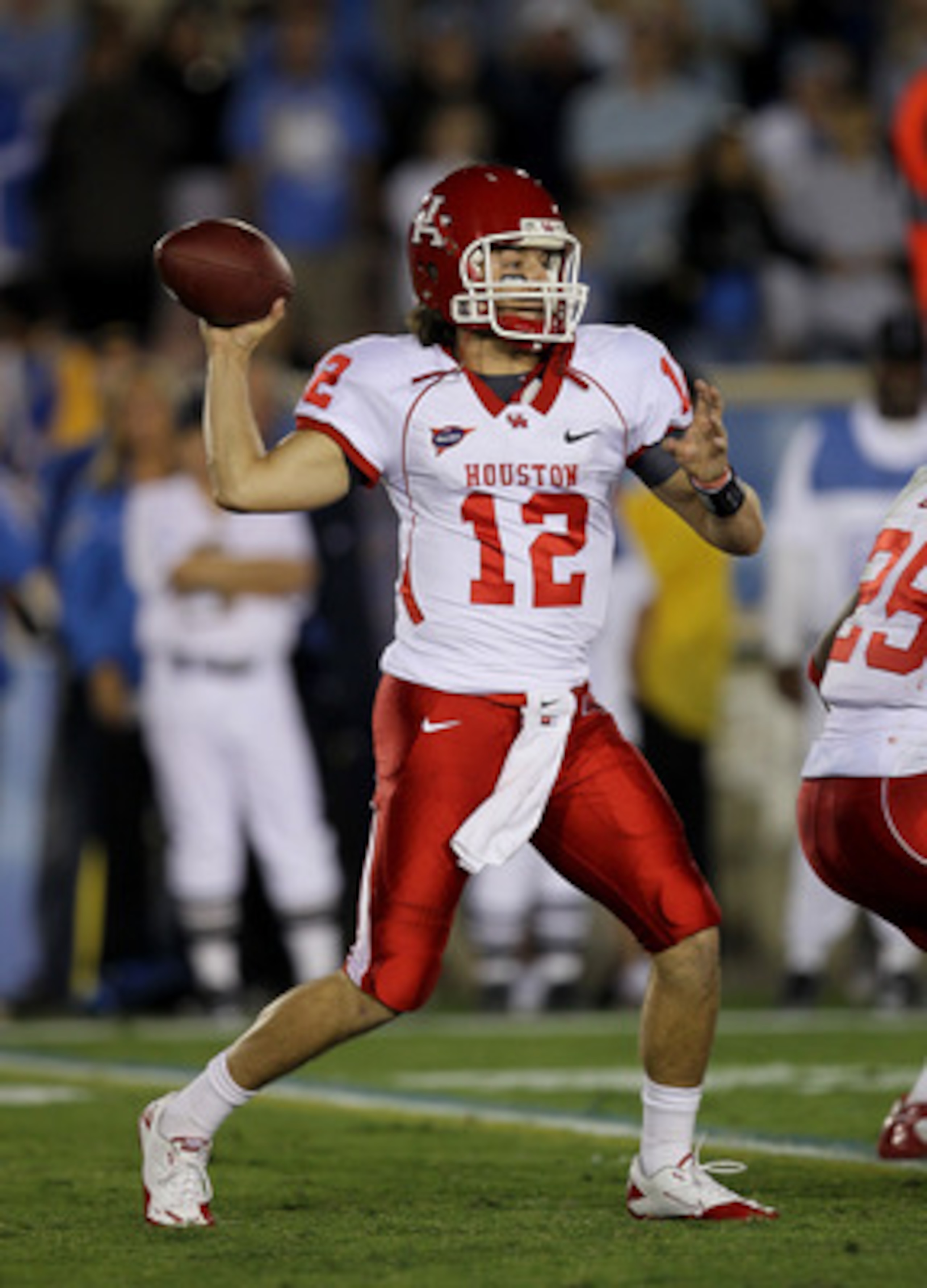 PASADENA, CA - SEPTEMBER 18:  Quarterback Cotton Turner #12 of the Houston Cougars throws a pass against the UCLA Bruins at the Rose Bowl on September 18, 2010 in Pasadena, California.  UCLA won 31-13.  (Photo by Stephen Dunn/Getty Images)