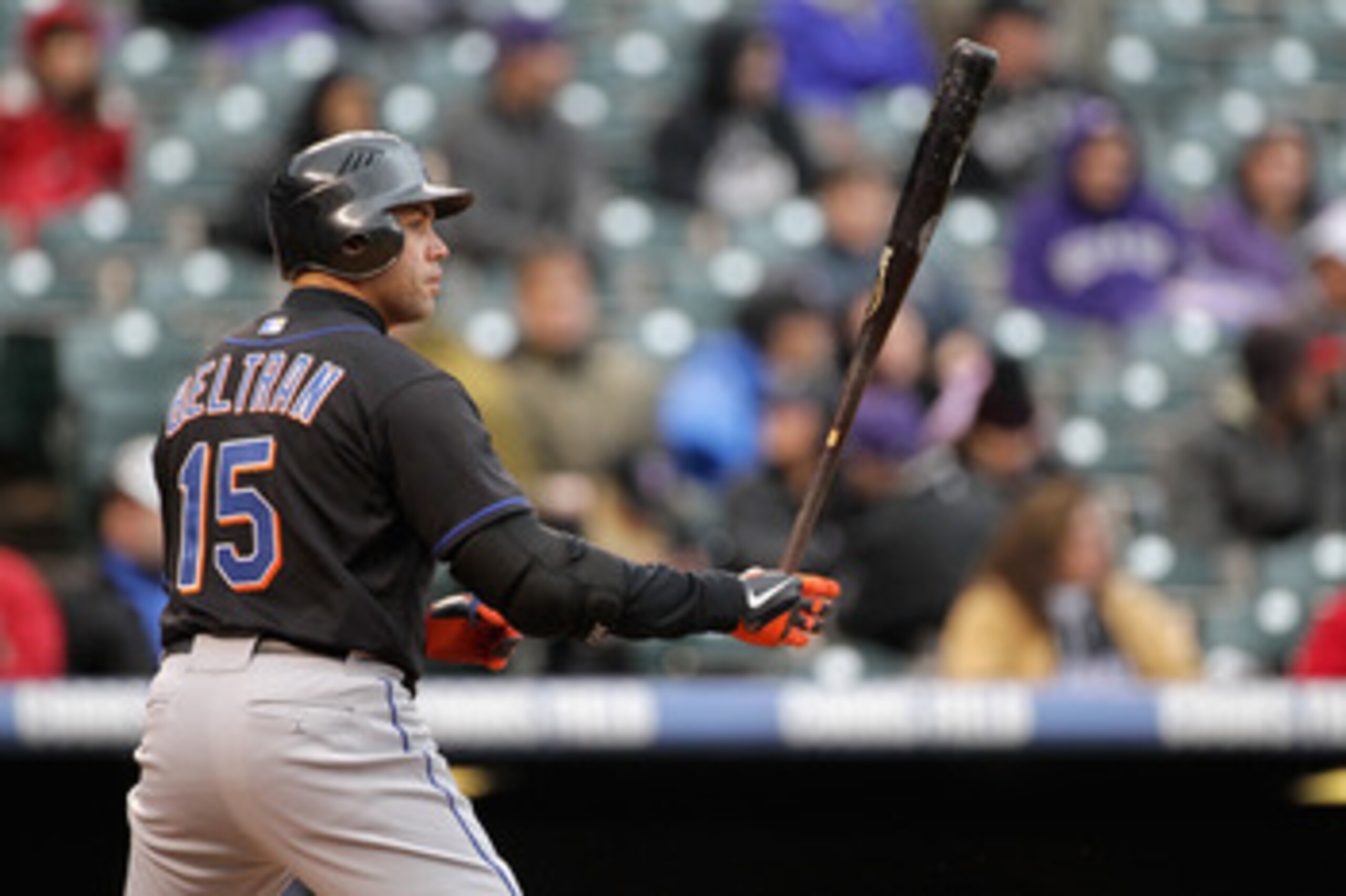 DENVER, CO - MAY 12:  Carlos Beltran #15 of the New York Mets takes an at bat against the Colorado Rockies at Coors Field on May 12, 2011 in Denver, Colorado.  (Photo by Doug Pensinger/Getty Images)