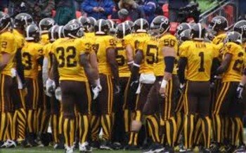 October 11, 2009 game against the Patriots adorned in 1960 Broncos throwback uniforms. The game featured the famous brown and mustard vertical striped socks.