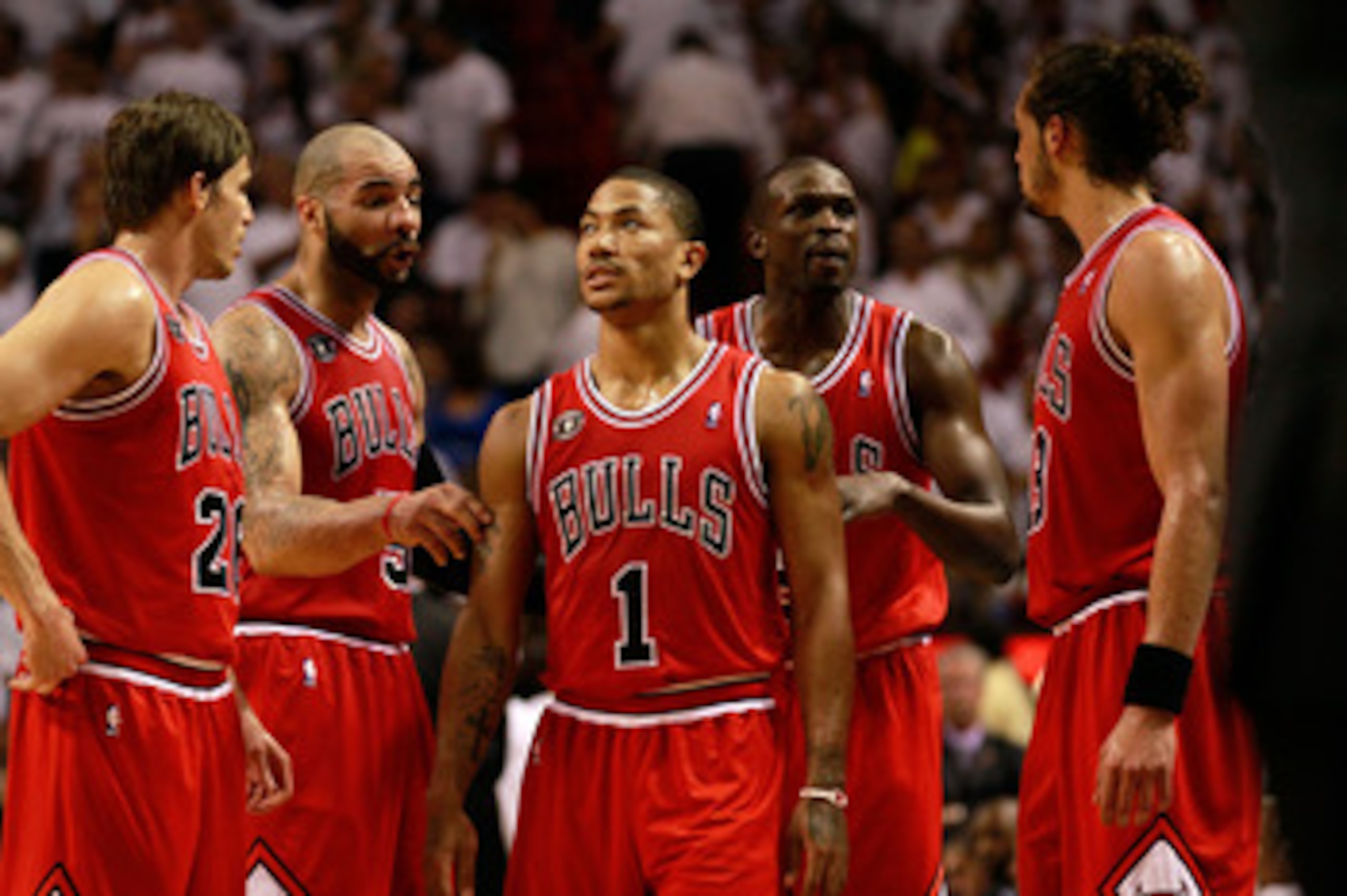 MIAMI, FL - MAY 24:  (L-R) Kyle Korver #26, Carlos Boozer #5, Derrick Rose #1, Luol Deng #9 and Joakim Noah #13 of the Chicago Bulls talk on court against the Miami Heat in Game Four of the Eastern Conference Finals during the 2011 NBA Playoffs on May 24,