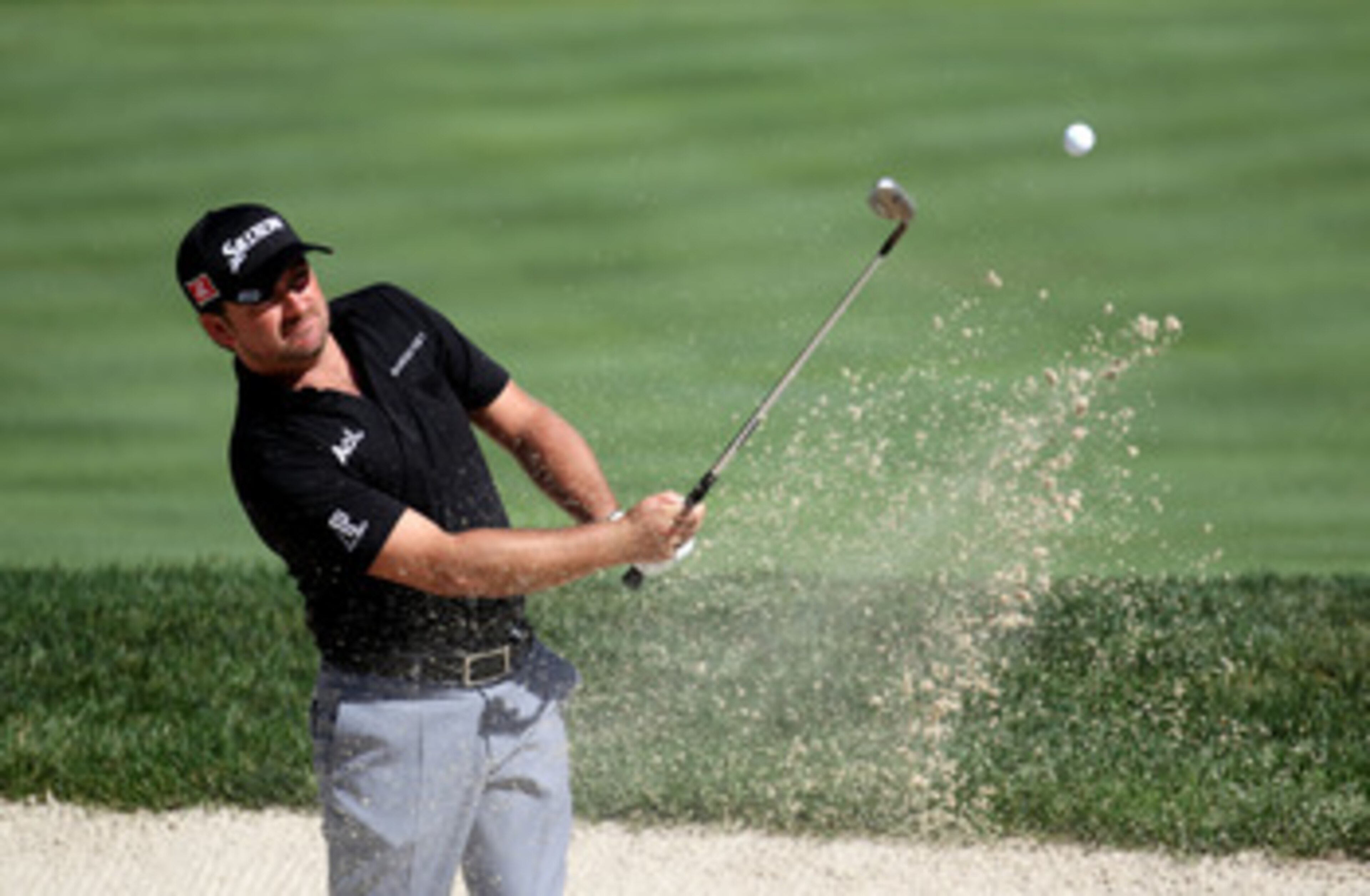 BETHESDA, MD - JUNE 13:  Graeme McDowell of Northern Ireland plays a bunker shot during a practice round prior to the start of the 111th U.S. Open at Congressional Country Club on June 13, 2011 in Bethesda, Maryland.  (Photo by Ross Kinnaird/Getty Images)