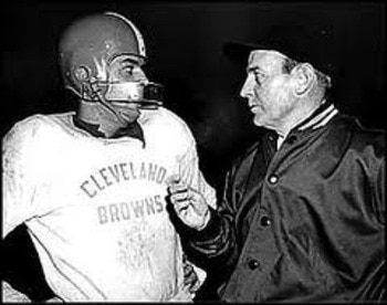 Browns head coach Paul Brown (right) invented the helmet face mask to help protect his QB Otto Graham (left).