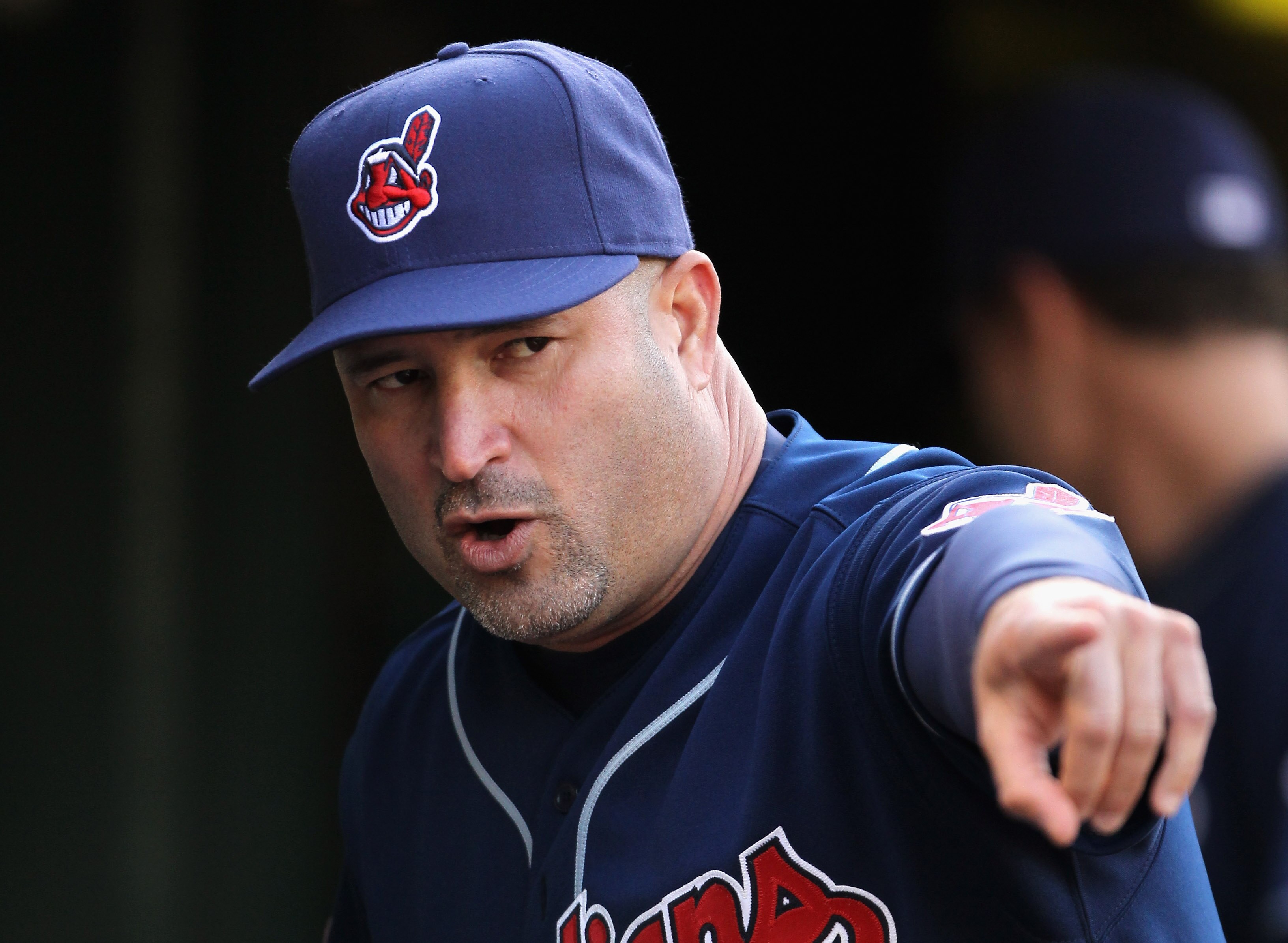 OAKLAND, CA - MAY 03:  Manager Manny Acta of the Cleveland Indians stands in the dugout before their game against the Oakland Athletics at Oakland-Alameda County Coliseum on May 3, 2011 in Oakland, California.  (Photo by Ezra Shaw/Getty Images)