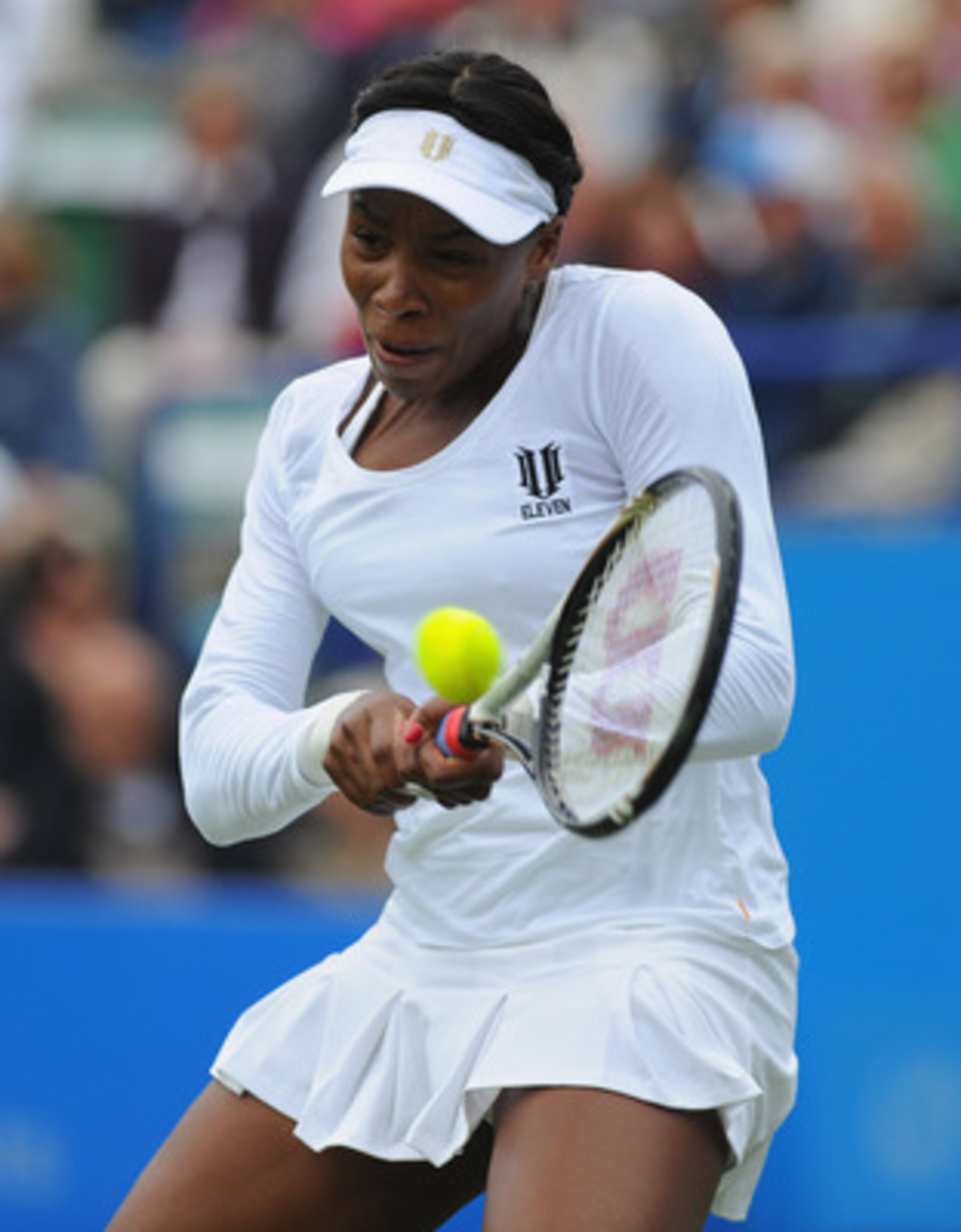 EASTBOURNE, ENGLAND - JUNE 13:  Venus Williams of USA plays a backhand in her match against Andrea Petkovic of Germany during Day Three of the AEGON International at Devonshire Park on June 13, 2011 in Eastbourne, England.  (Photo by Mike Hewitt/Getty Ima