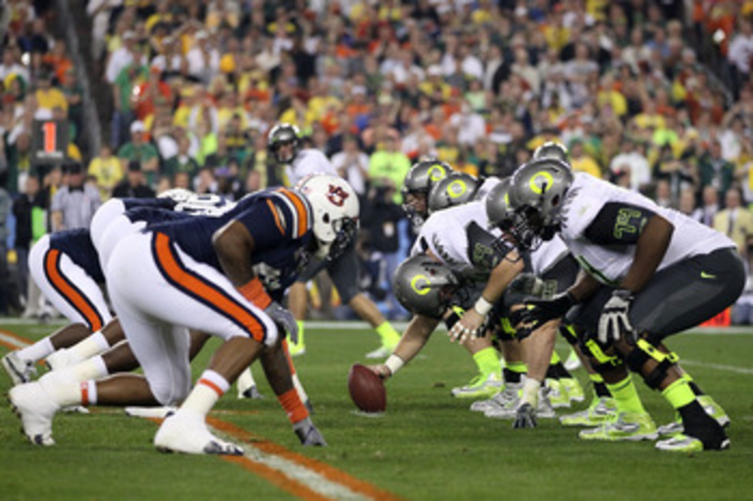 GLENDALE, AZ - JANUARY 10:  Center Jordan Holmes #54 of the Oregon Ducks prepares to snap the ball against the Auburn Tigers during the Tostitos BCS National Championship Game at University of Phoenix Stadium on January 10, 2011 in Glendale, Arizona.  (Ph