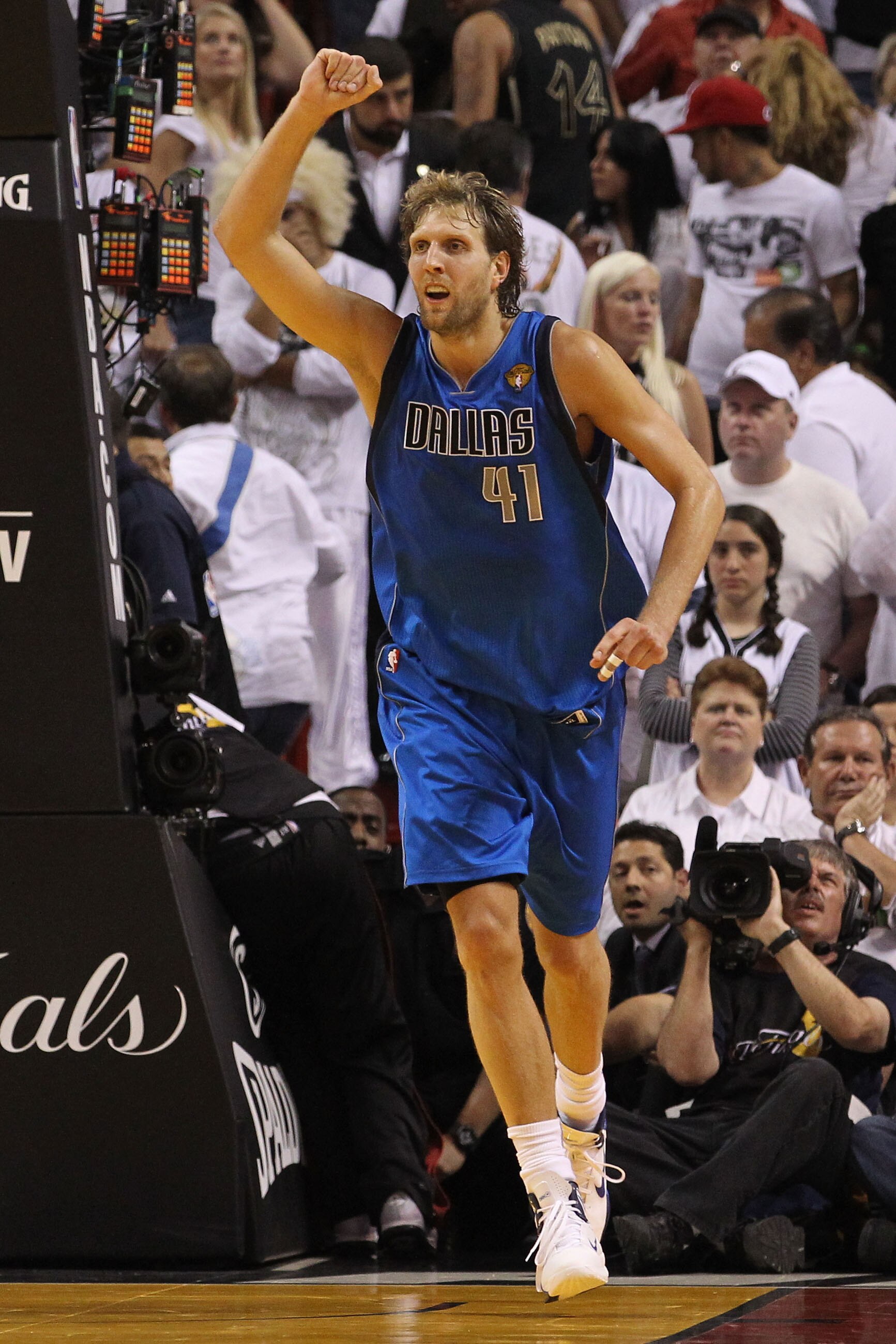 MIAMI, FL - JUNE 12:  Dirk Nowitzki #41 of the Dallas Mavericks celebrates while taking on the Miami Heat in the fourth quarter in Game Six of the 2011 NBA Finals at American Airlines Arena on June 12, 2011 in Miami, Florida. The Mavericks won 105-95. NOT