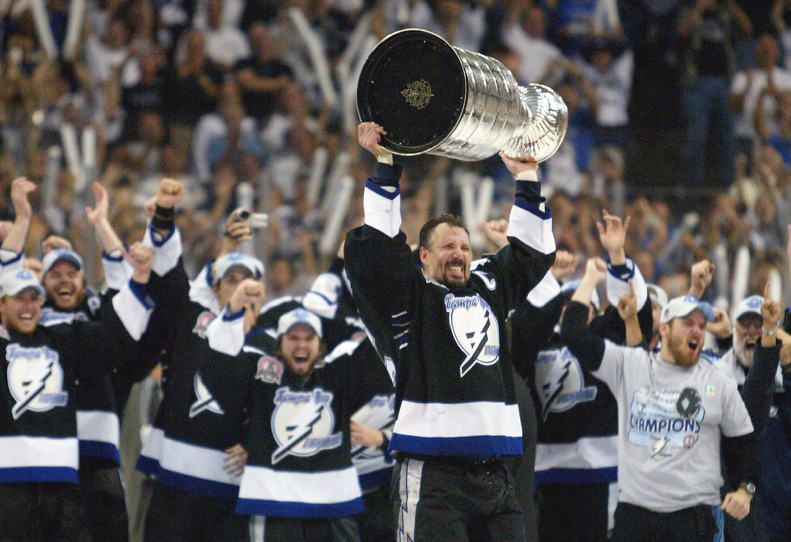 TAMPA, FL - JUNE 7:   Dave Andreychuk #25 of the Tampa Bay Lightning skates with the Stanley Cup after defeating the Calgary Flames in game seven of the NHL Stanley Cup Finals on June 7, 2004 at the St. Pete Times Forum in Tampa, Florida.  The Lightning w