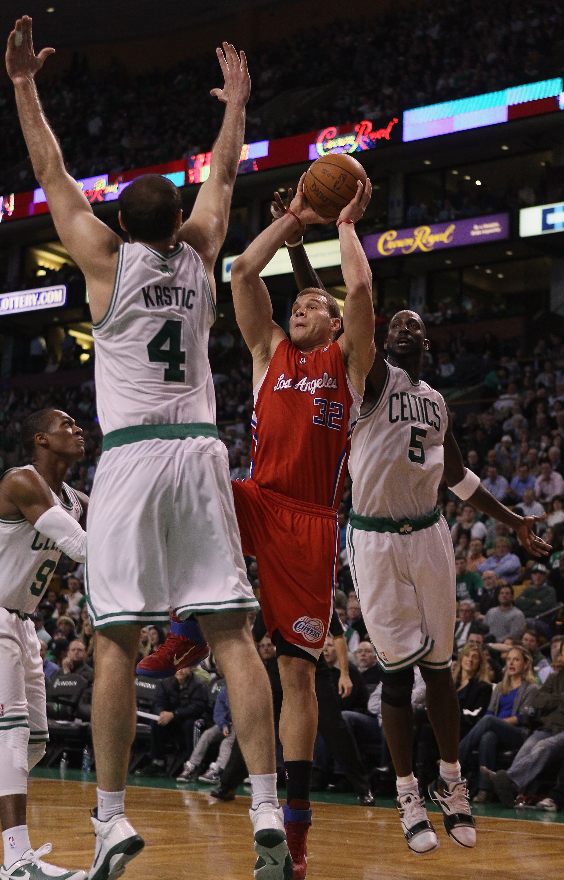 BOSTON, MA - MARCH 09:  Blake Griffin #32 of the Los Angeles Clippers takes a shot as Kevin Garnett #5 and Nenad Krstic #4 of the Boston Celtics defend on March 9, 2011 at the TD Garden in Boston, Massachusetts. The Los Angeles Clippers defeated the Bosto