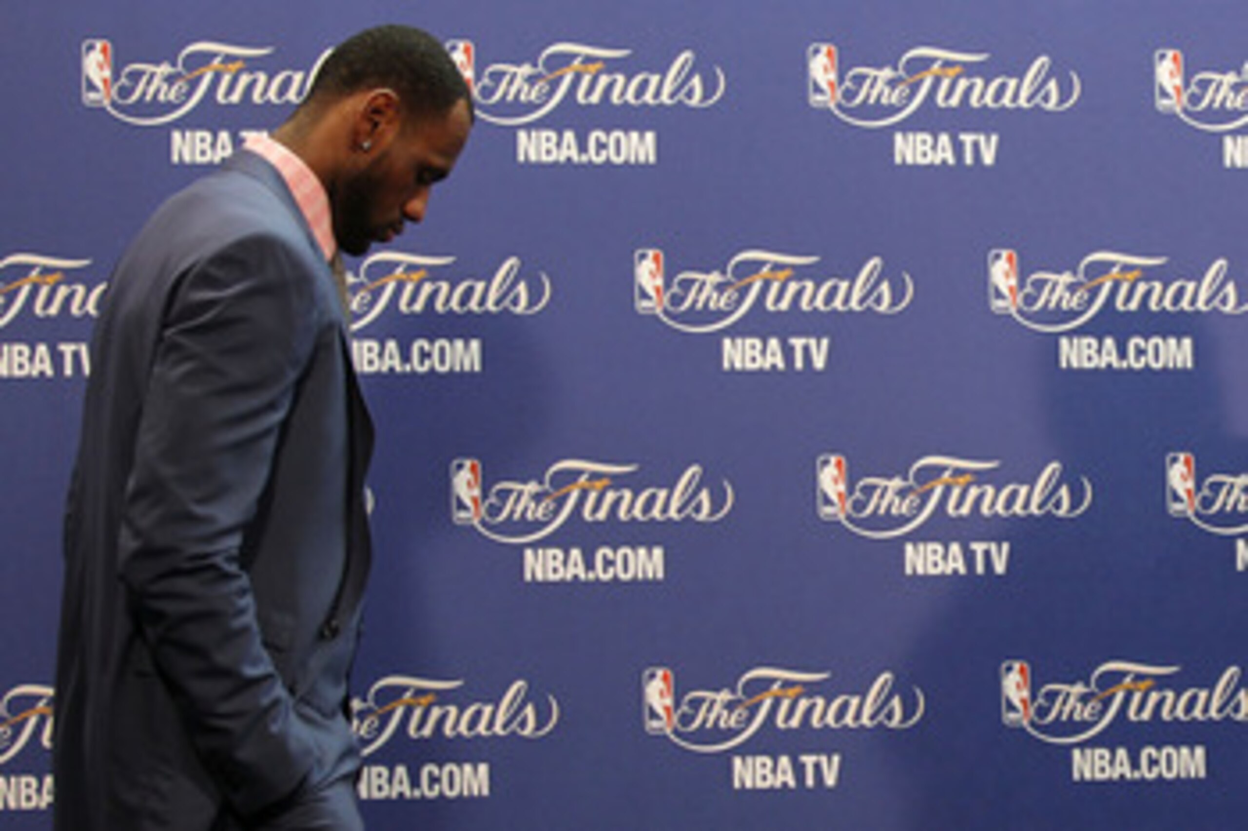 MIAMI, FL - JUNE 12:  LeBron James #6 of the Miami Heat walks into the interview room to answer questions after the Heat were defeated 105-95 by the Dallas Mavericks in Game Six of the 2011 NBA Finals at American Airlines Arena on June 12, 2011 in Miami,