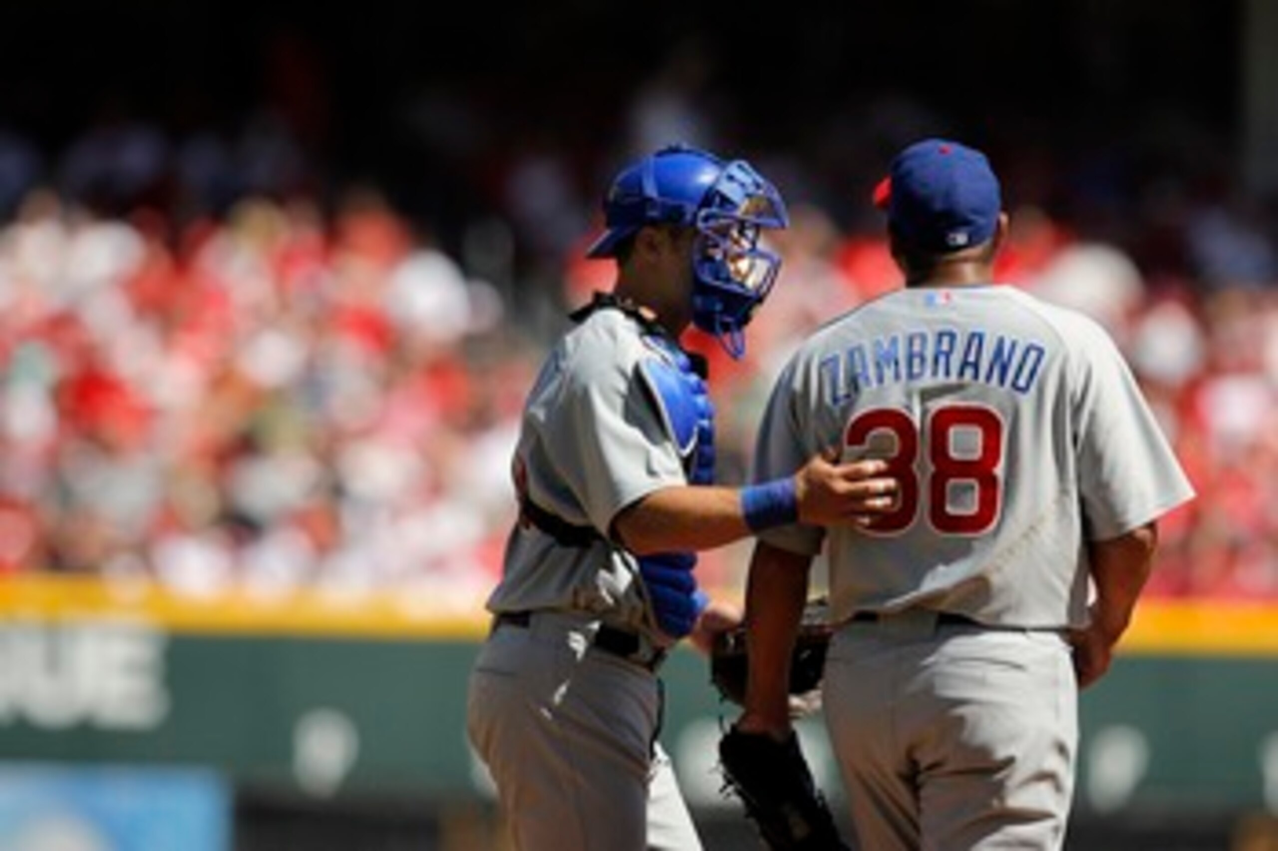 CINCINNATI - APRIL 2:   Catcher Michael Barrett #8 of the Chicago Cubs talks to pitcher Carlos Zambrano #38 during Opening Day action against the Cincinnati Reds April 2, 2007 at Great American Ballpark in Cincinnati, Ohio.  Cincinnati led 5-1 after five 