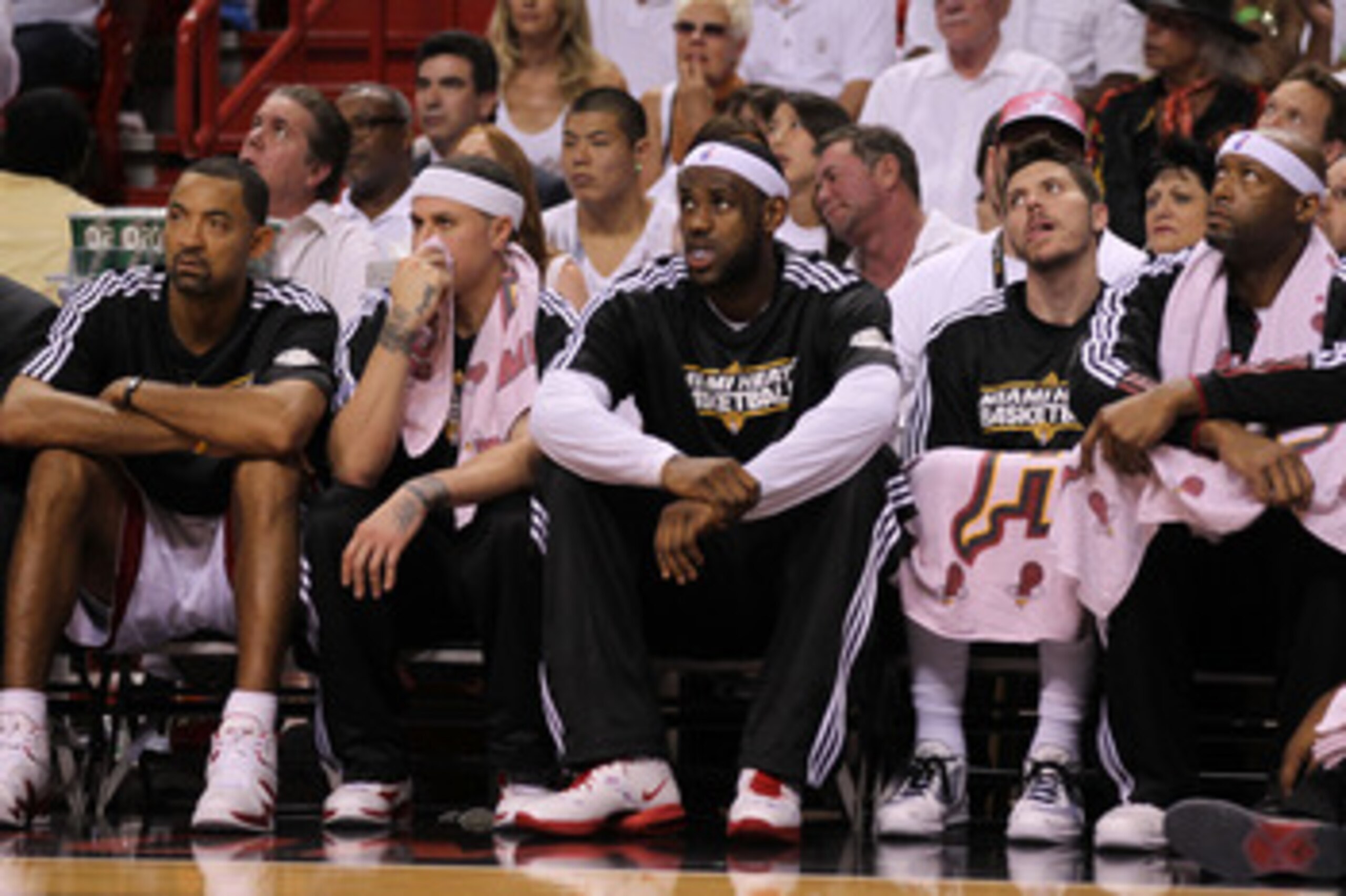 MIAMI, FL - JUNE 12:  (L-R) Juwan Howard #5, Mike Bibby #0, LeBron James #6, Mike Miller #13 and Erick Dampier #25 of the Miami Heat look on from the bench in the first half against the Dallas Mavericks in Game Six of the 2011 NBA Finals at American Airli