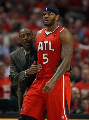 CHICAGO, IL - MAY 10: Head coach Larry Drew of the Atlanta Hawks walks down the court with Josh Smith #5 after an altercation against the Chicago Bulls in Game Five of the Eastern Conference Semifinals in the 2011 NBA Playoffs at the United Center on May 