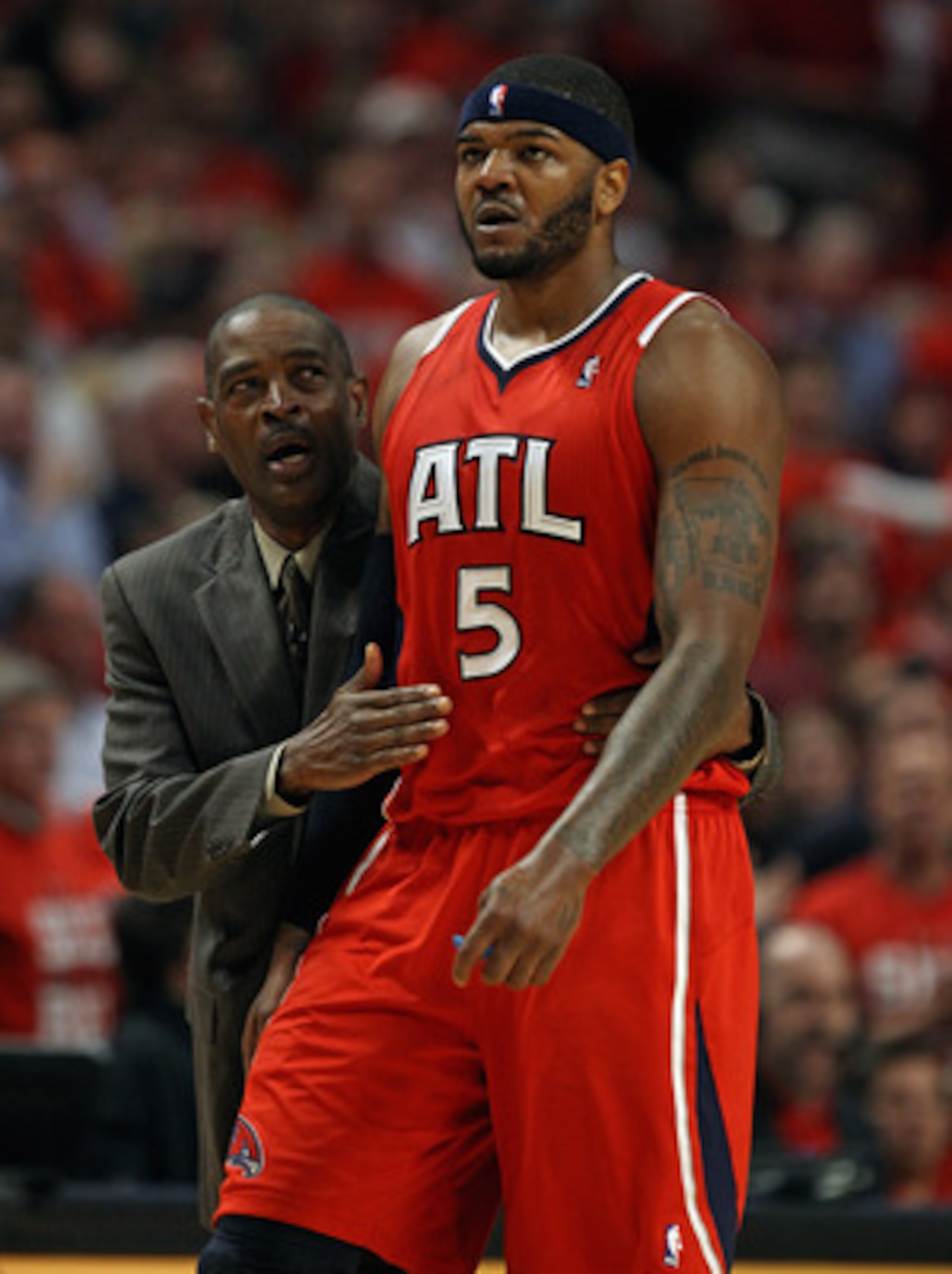 CHICAGO, IL - MAY 10: Head coach Larry Drew of the Atlanta Hawks walks down the court with Josh Smith #5 after an altercation against the Chicago Bulls in Game Five of the Eastern Conference Semifinals in the 2011 NBA Playoffs at the United Center on May 