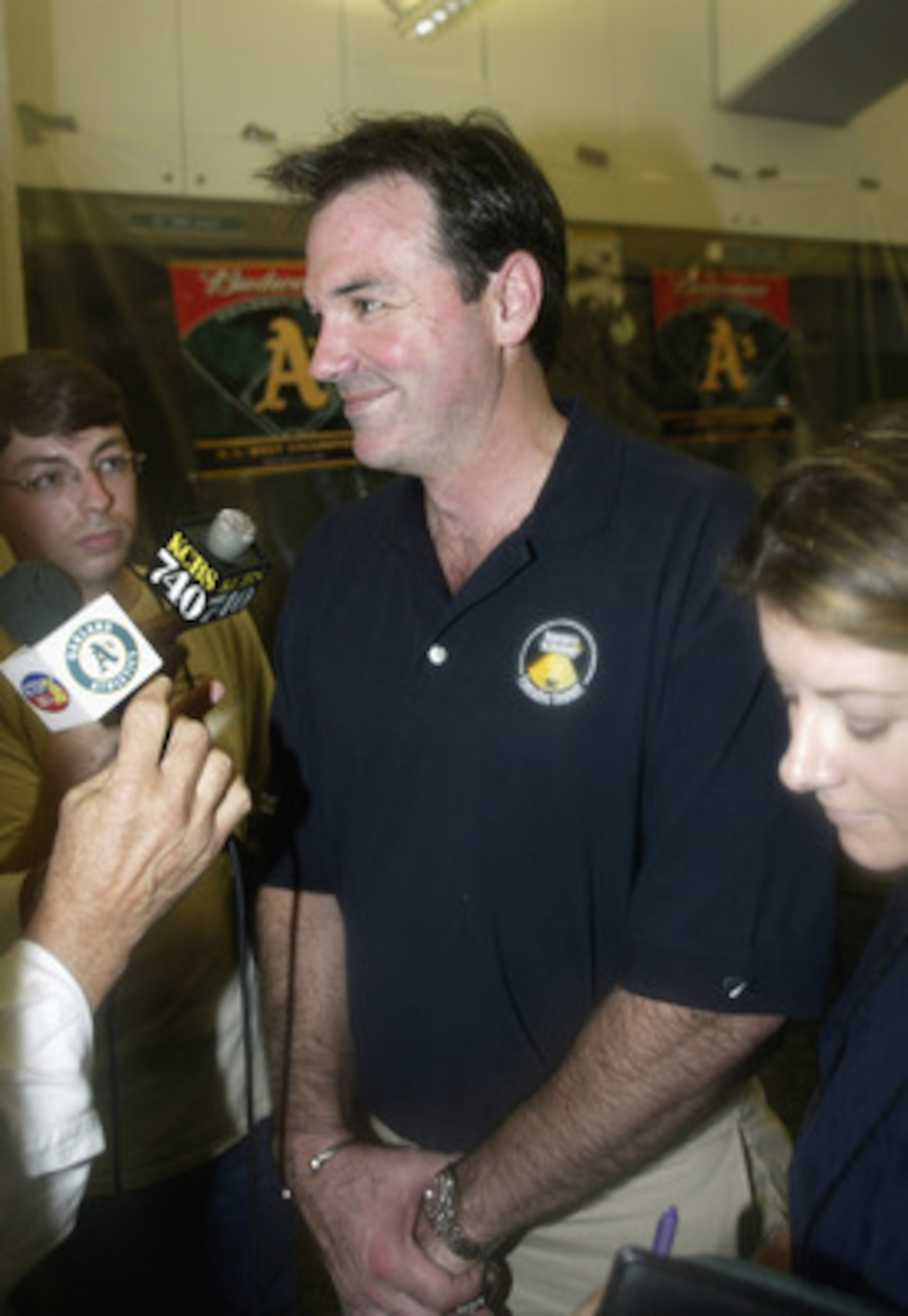 OAKLAND, CA - SEPTEMBER 23:  Billy Bean speaks to the media after the game between the Texas Rangers and the Oakland A's at the Network Associates Coliseum on September 23, 2003 in Oakland, California.  The Athletics defeated the Rangers 4-3.  (Photo by J