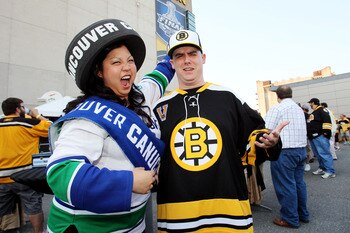 BOSTON, MA - JUNE 08:  A fan of the Vancouver Canucks  and a fan of the Boston Bruins pose for a photo prior to Game Four of the 2011 NHL Stanley Cup Final between the Vancouver Canucks and the Boston Bruins at TD Garden on June 8, 2011 in Boston, Massach