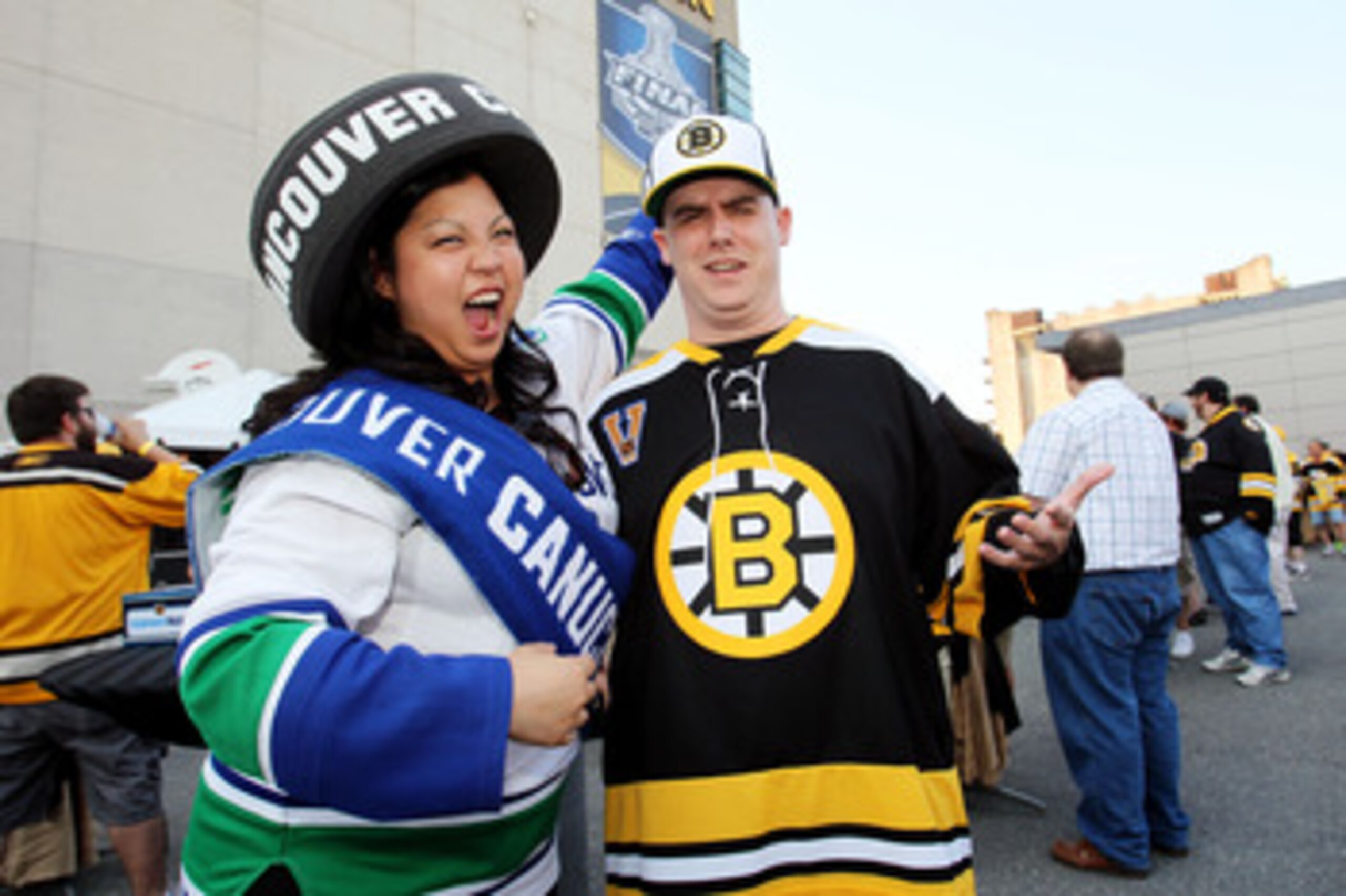 BOSTON, MA - JUNE 08:  A fan of the Vancouver Canucks  and a fan of the Boston Bruins pose for a photo prior to Game Four of the 2011 NHL Stanley Cup Final between the Vancouver Canucks and the Boston Bruins at TD Garden on June 8, 2011 in Boston, Massach