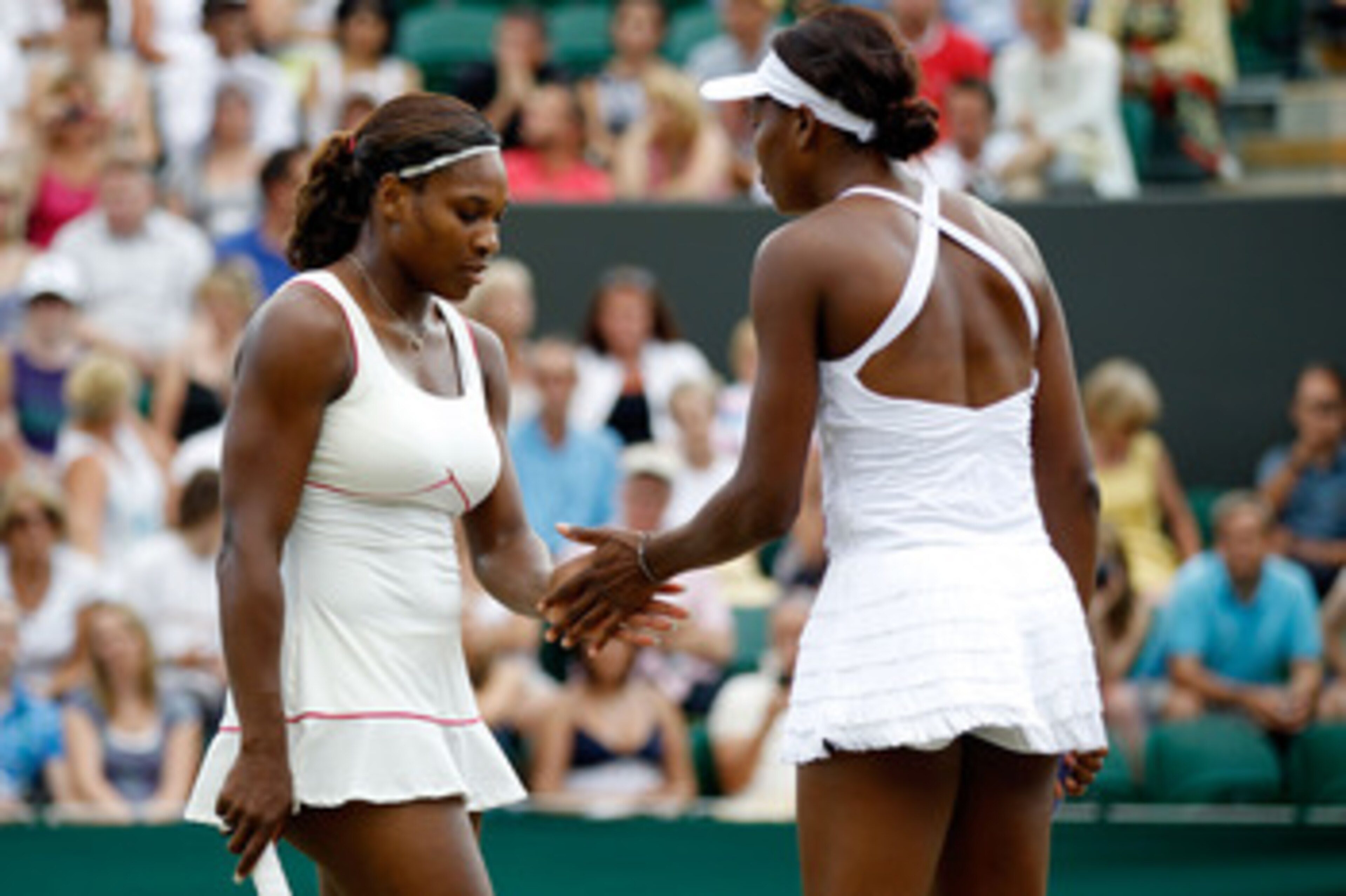 LONDON, ENGLAND - JUNE 26: Serena Williams of USA and Venus Williams of USA in action during their doubles match against Dominika Cibulkova of Slovakia and Anastasia Pavlyuchenkova of Russia on Day Six of the Wimbledon Lawn Tennis Championships at the A LONDON, ENGLAND - JUNE 26: Serena Williams of USA and Venus Williams of USA in action during their doubles match against Dominika Cibulkova of Slovakia and Anastasia Pavlyuchenkova of Russia on Day Six of the Wimbledon Lawn Tennis Championships at the A
