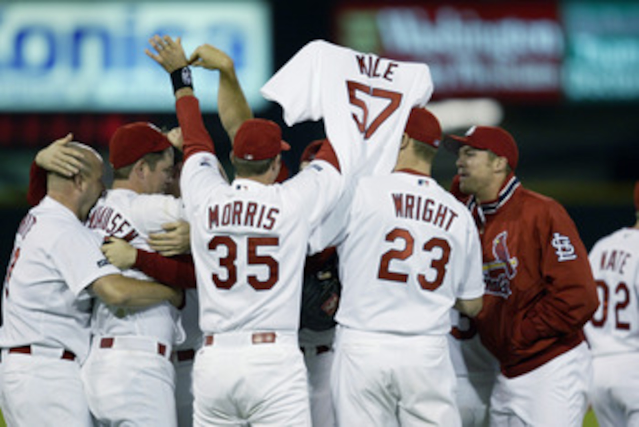 ST. LOUIS - OCTOBER 5:  The St. Louis Cardinals pay tribute to teammate Darryl Kile #57 who past away early in the year, as they celebrate the victory over the Arizona Diamondbacks in Game three of the MLB National League Division Series during the 2002 W