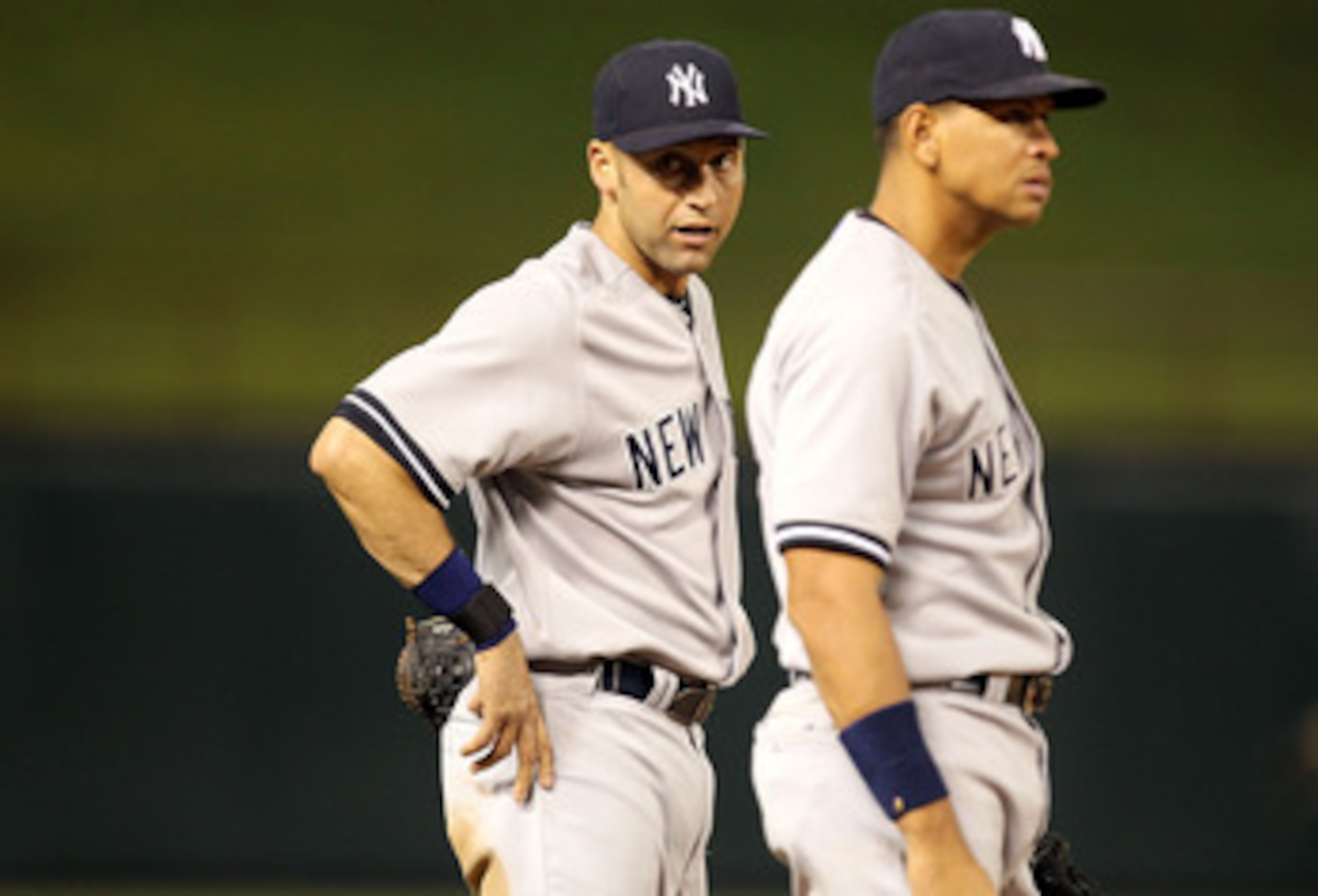 ARLINGTON, TX - MAY 07:  Derek Jeter #2 and Alex Rodriguez #13 of the New York Yankees talk between innings at Rangers Ballpark in Arlington on May 7, 2011 in Arlington, Texas.  (Photo by Ronald Martinez/Getty Images)