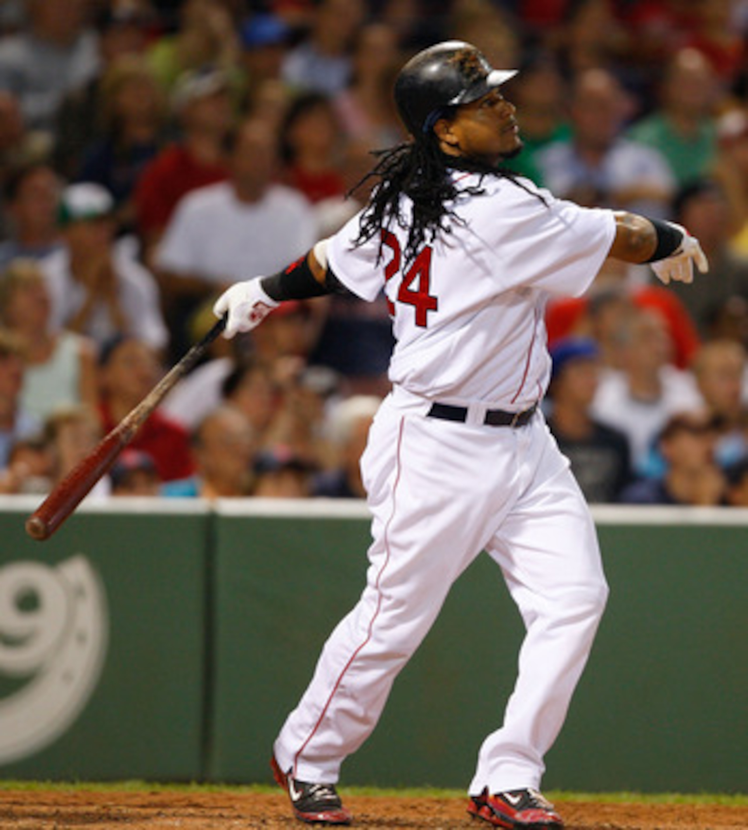 BOSTON - JULY 30: Manny Ramirez #24 of the Boston Red Sox watches the flight of a fly ball during his last at bat with the Red Sox against the Los Angeles Angels of Anaheim at Fenway Park on July 30, 2008 in Boston, Massachusetts.  (Photo by Jim Rogash/Ge