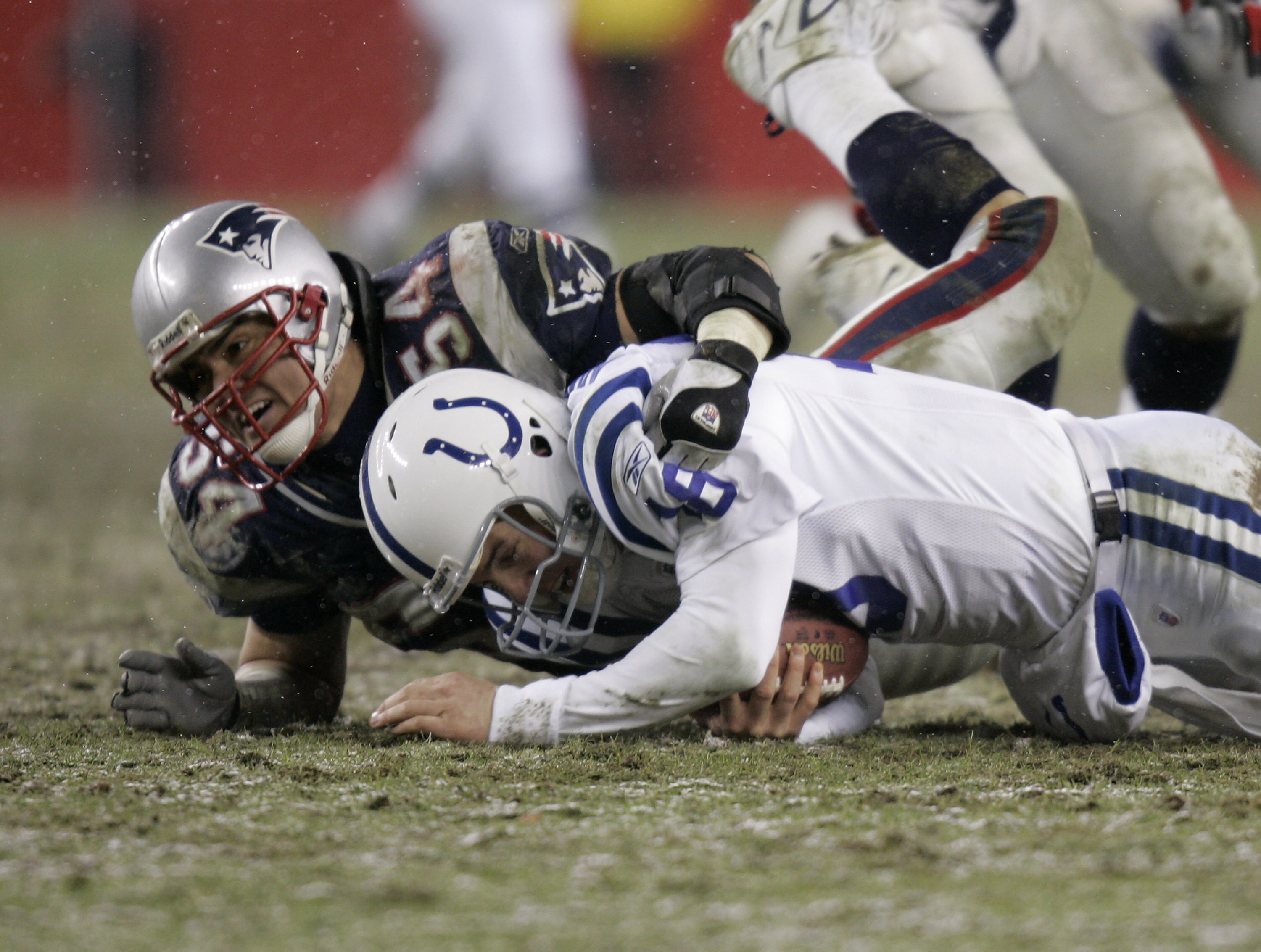 Linebacker Tedy Bruschi of the New England Patriots sacks Colts quarterback Peyton Manning during the AFC Division playoff game at Gillette Stadium in Foxboro, Massachusetts on January 16, 2005. The Patriots beat the Colts 20-3 to advance to the AFC Champ