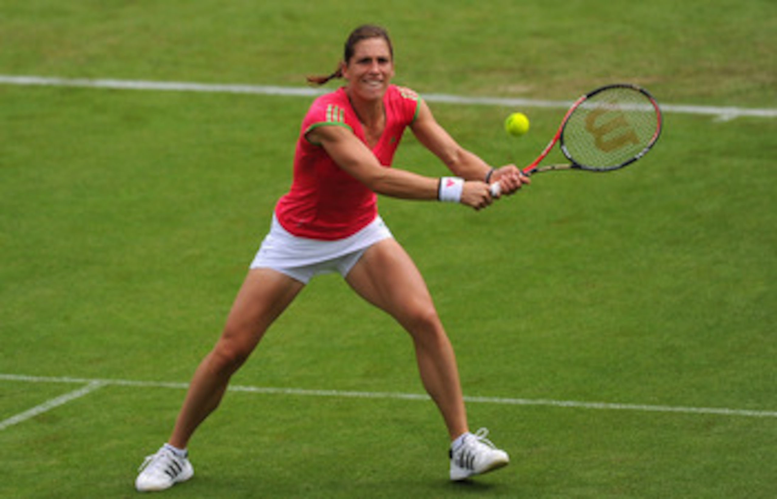 EASTBOURNE, ENGLAND - JUNE 13:  Andrea Petkovic of Germany in action against Venus Williams of USA during Day Three of the AEGON International at Devonshire Park on June 13, 2011 in Eastbourne, England.  (Photo by Mike Hewitt/Getty Images)