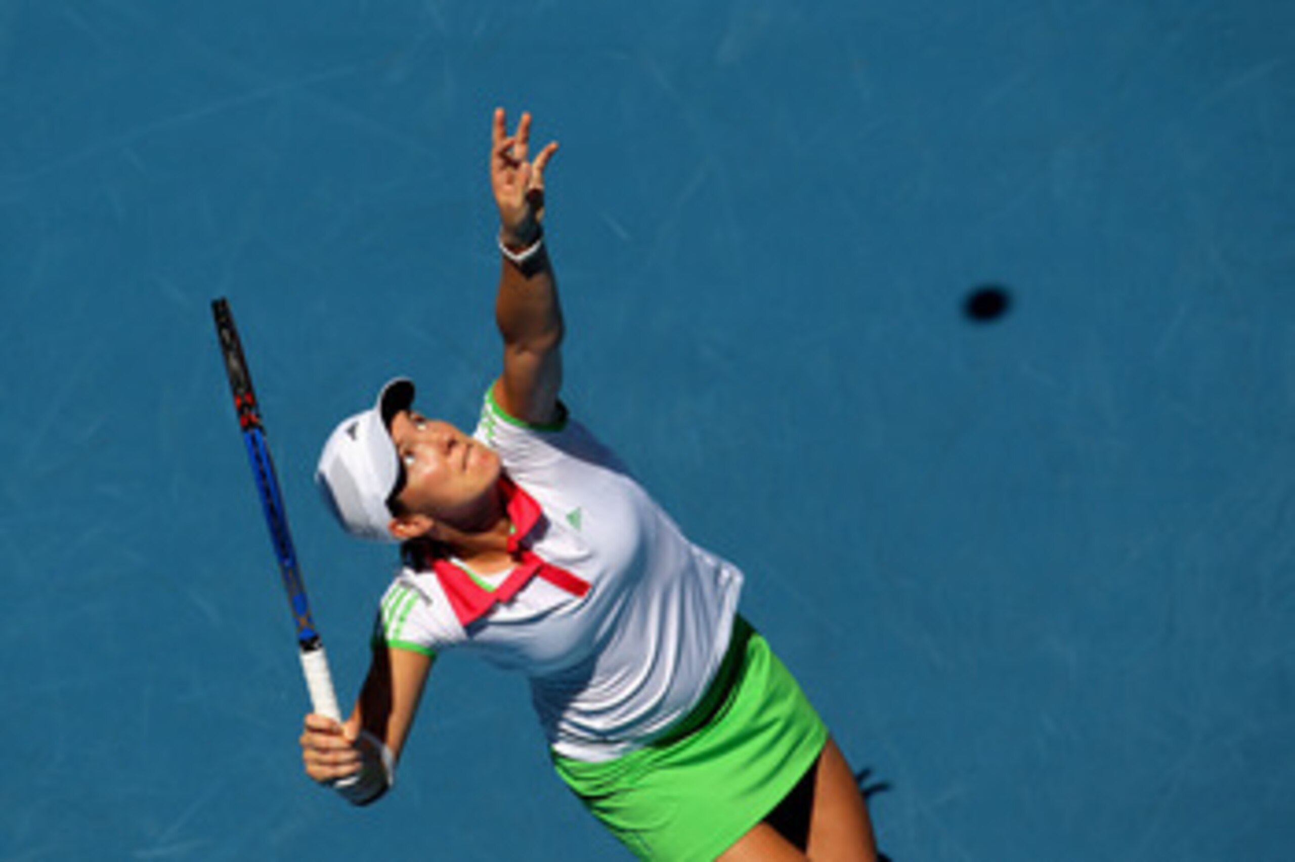 MELBOURNE, AUSTRALIA - JANUARY 21:  Justine Henin of Belgium serves in her third round match against Svetlana Kuznetsova of Russia during day five of the 2011 Australian Open at Melbourne Park on January 21, 2011 in Melbourne, Australia.  (Photo by Camero