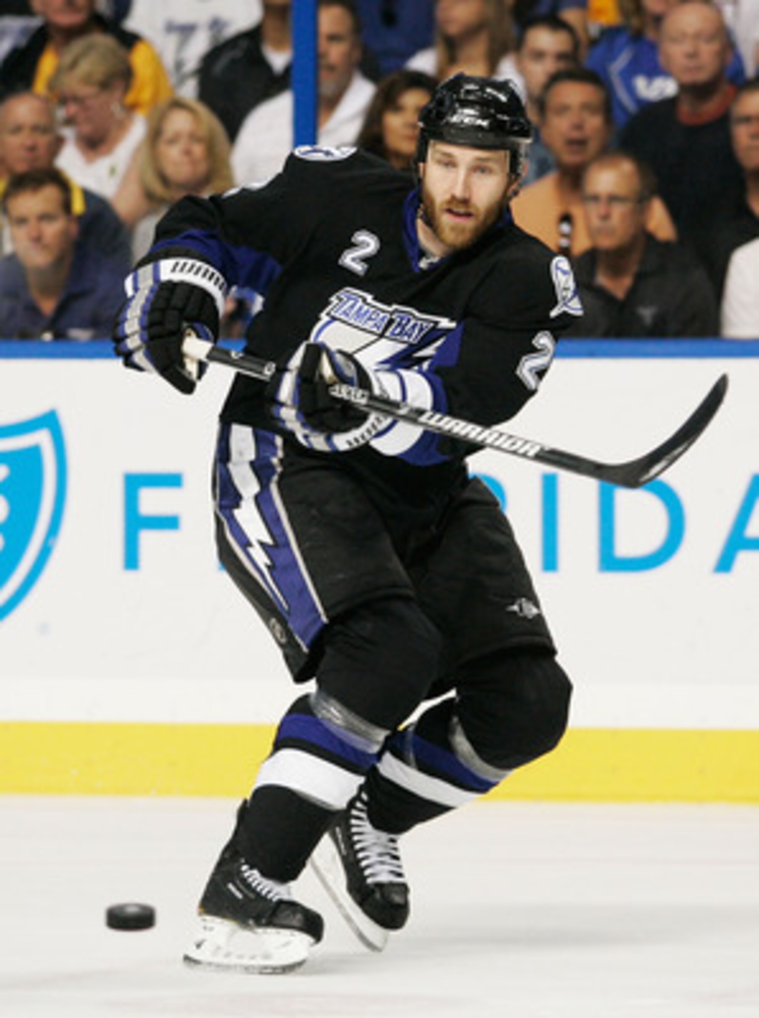TAMPA, FL - MAY 21:  Eric Brewer #2 of the Tampa Bay Lightning controls the puck in Game Four of the Eastern Conference Finals against the Boston Bruins during the 2011 NHL Stanley Cup Playoffs at St Pete Times Forum on May 21, 2011 in Tampa, Florida.  (P
