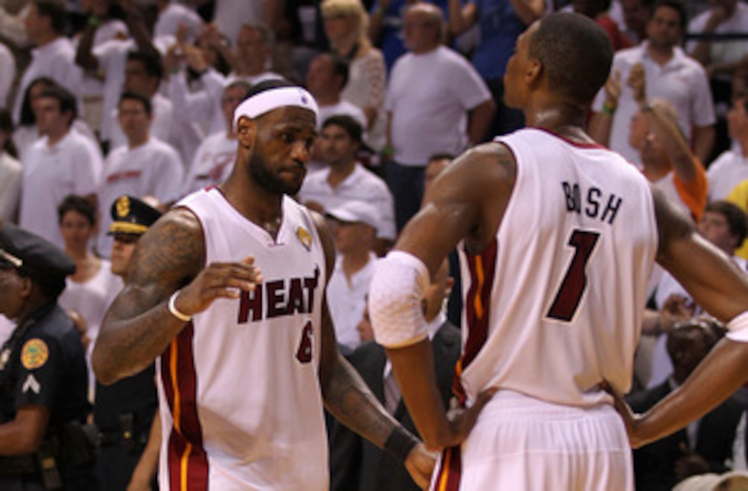 MIAMI, FL - JUNE 12:  LeBron James #6 and Chris Bosh #1 of the Miami Heat look on dejected after the Heat lost to the Dallas Mavericks 105-95 in Game Six of the 2011 NBA Finals at American Airlines Arena on June 12, 2011 in Miami, Florida. NOTE TO USER: U