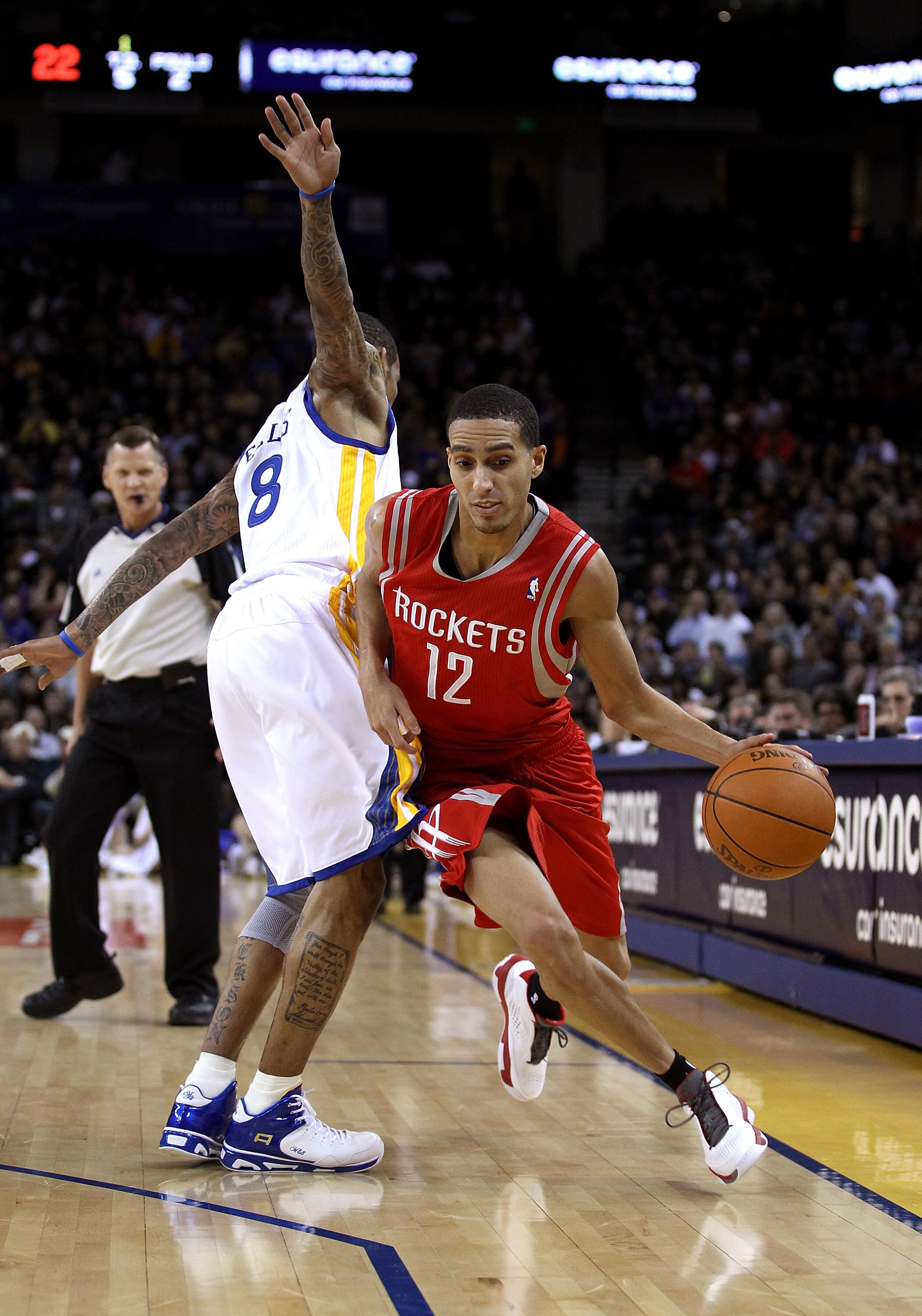 OAKLAND, CA - DECEMBER 20:  Kevin Martin #12 of the Houston Rockets dribbles around Monta Ellis #8 of the Golden State Warriors at Oracle Arena on December 20, 2010 in Oakland, California. NOTE TO USER: User expressly acknowledges and agrees that, by down