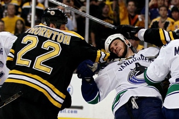 BOSTON, MA - JUNE 13:  Shawn Thornton #22 of the Boston Bruins fights with Kevin Bieksa #3 of the Vancouver Canucks during Game Six of the 2011 NHL Stanley Cup Final at TD Garden on June 13, 2011 in Boston, Massachusetts.  (Photo by Elsa/Getty Images)
