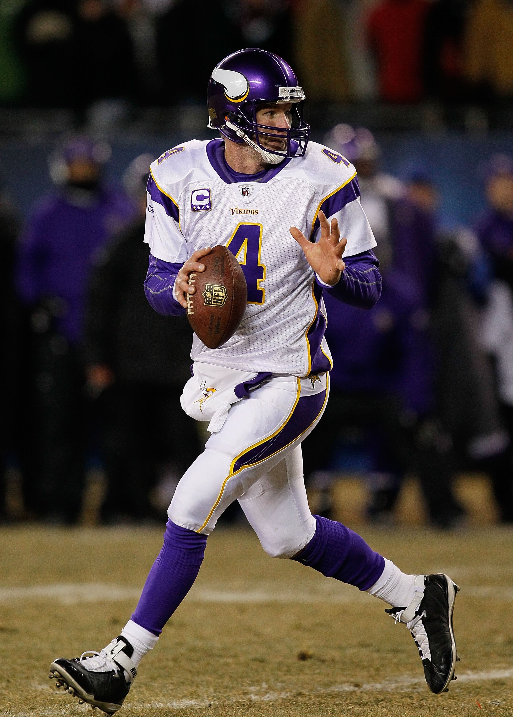 CHICAGO - DECEMBER 28: Brett Favre #4 of the Minnesota Vikings looks for a receiver against the Chicago Bears at Soldier Field on December 28, 2009 in Chicago, Illinois. The Bears defeated the Vikings 36-30 in overtime. (Photo by Jonathan Daniel/Getty Ima