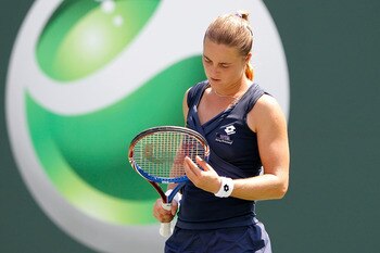 KEY BISCAYNE, FL - MARCH 25:  Anastasiya Yakimova of Belarus inspects her racquet against Kim Clijsters of Belgium during the Sony Ericsson Open at Crandon Park Tennis Center on March 25, 2011 in Key Biscayne, Florida.  (Photo by Matthew Stockman/Getty Im