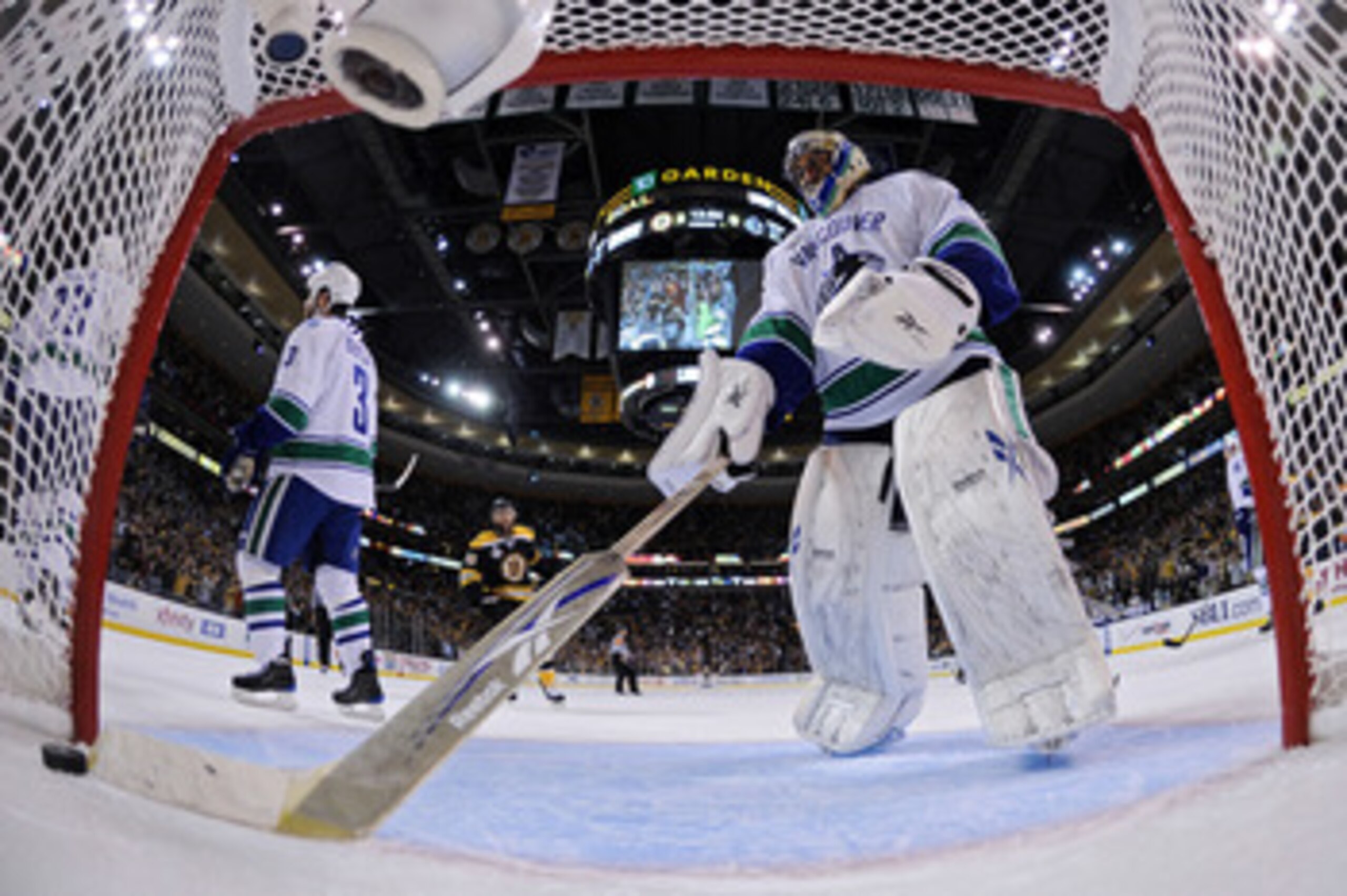 BOSTON, MA - JUNE 13:  Roberto Luongo #1 of the Vancouver Canucks grabs the puck out of the net after a goal scored by Milan Lucic #17 of the Boston Bruins in the first period of Game Six in the 2011 NHL Stanley Cup Final at TD Garden on June 13, 2011 in